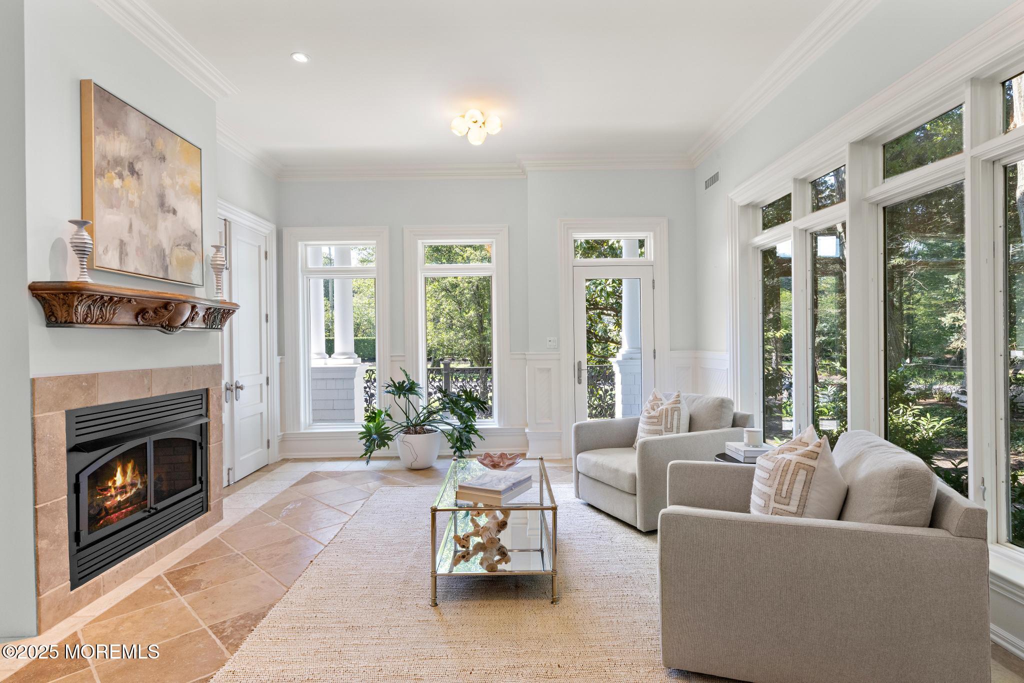 129 Ave Of Two Rivers Rumson, NJ 07760 - Photo 22 of 55 a living room with furniture large window and a fireplace