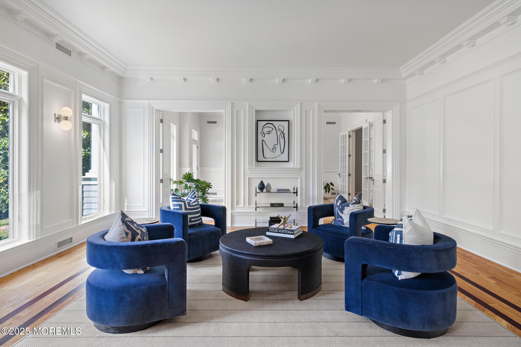 129 Ave Of Two Rivers Rumson, NJ 07760 - Photo 23 of 55 a living room with couches a table and chairs