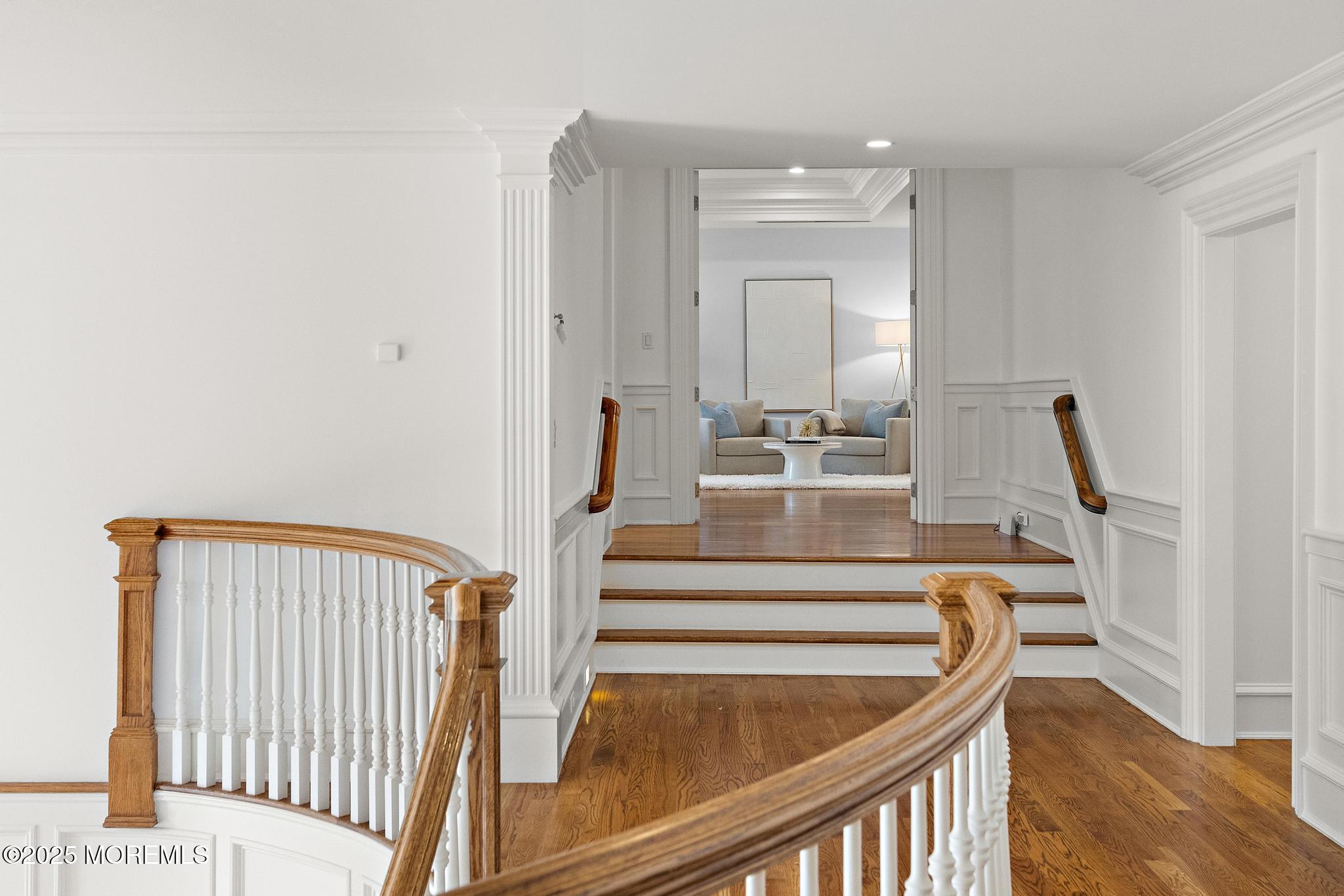 129 Ave Of Two Rivers Rumson, NJ 07760 - Photo 30 of 55 a view of staircase with white walls and railing