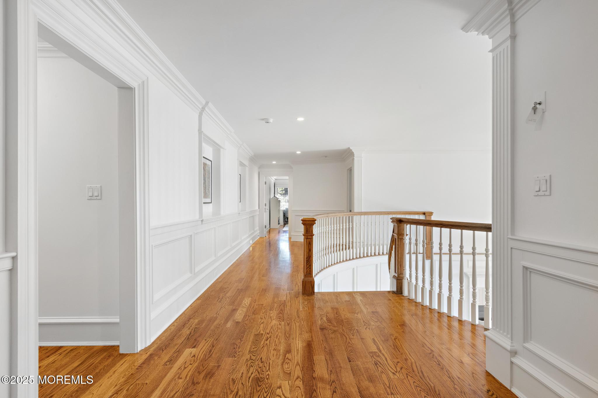 129 Ave Of Two Rivers Rumson, NJ 07760 - Photo 36 of 55 a view of a hallway with wooden floor