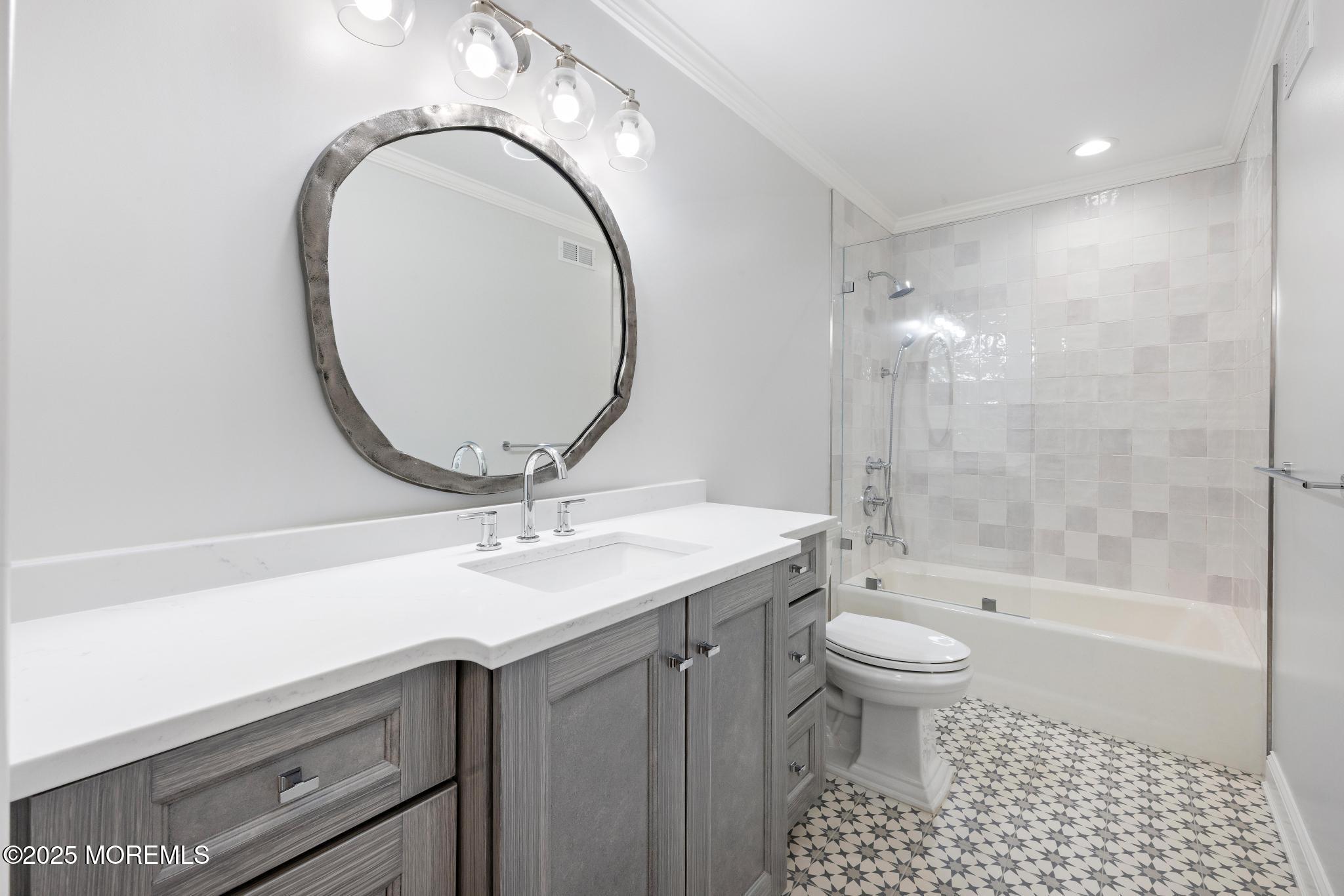 129 Ave Of Two Rivers Rumson, NJ 07760 - Photo 38 of 55 a bathroom with a sink a toilet and a mirror