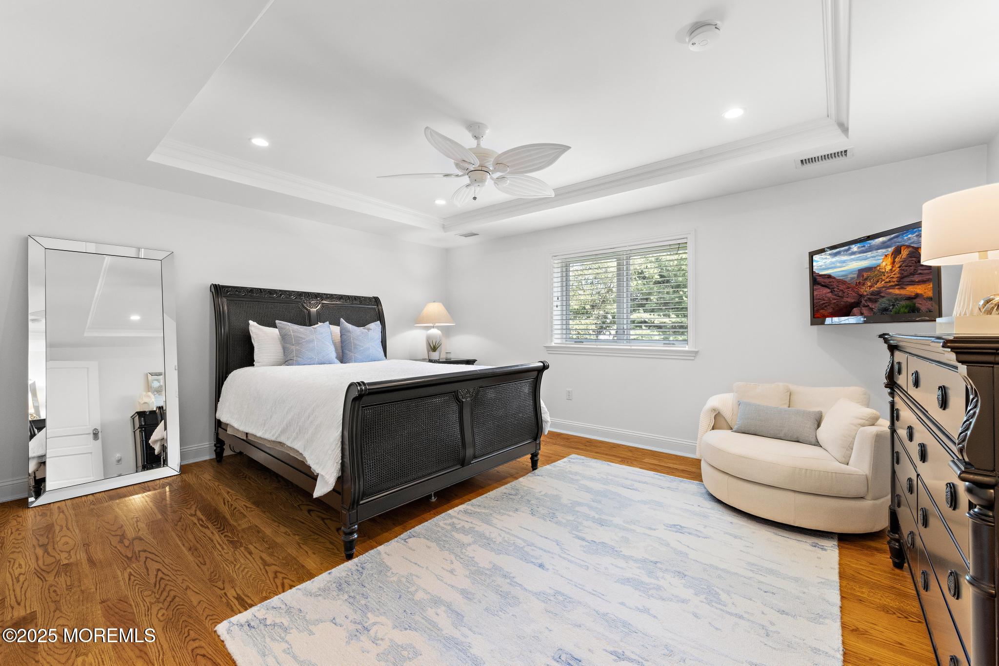 129 Ave Of Two Rivers Rumson, NJ 07760 - Photo 39 of 55 a bedroom with a bed and a couch