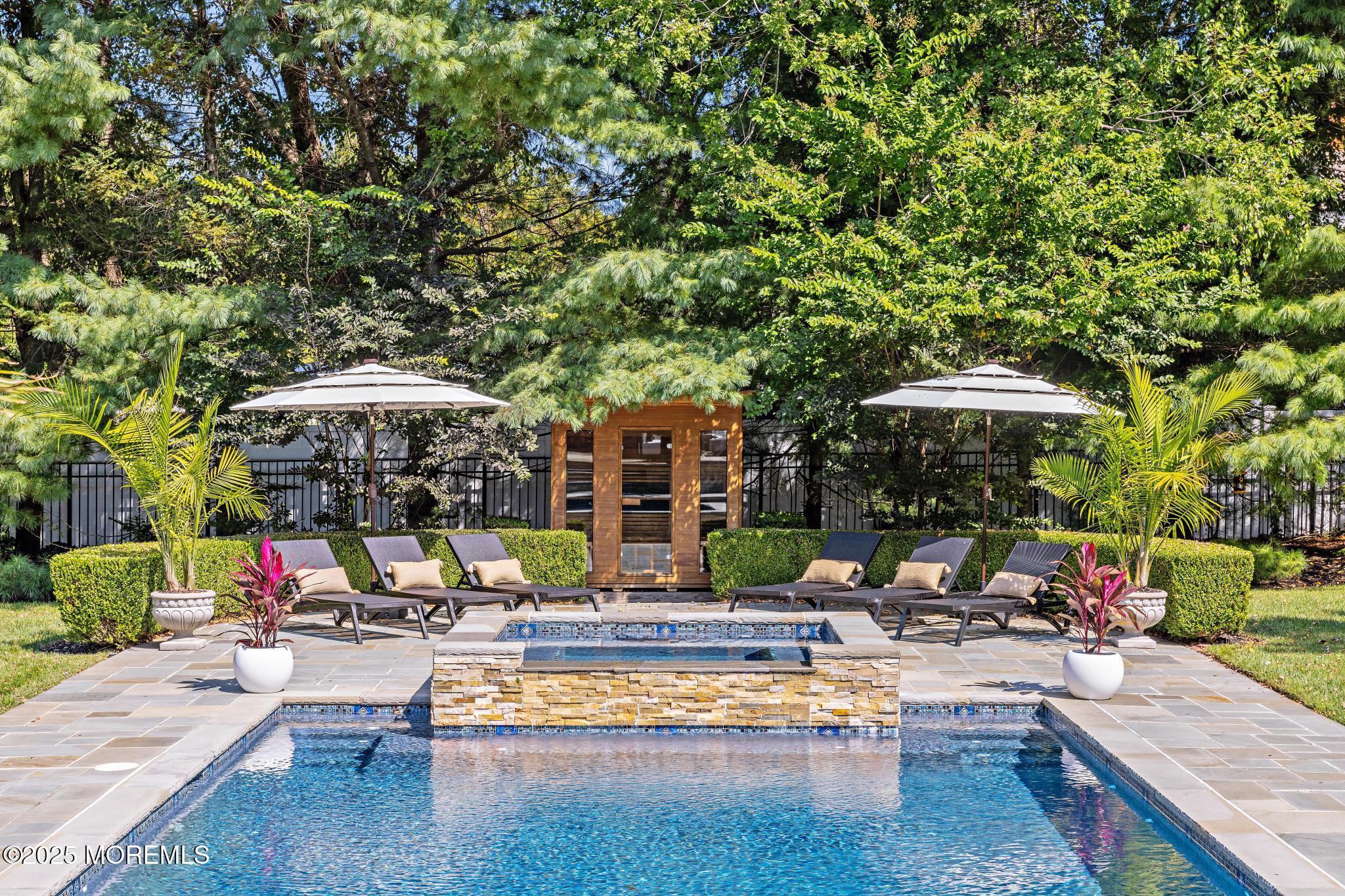 129 Ave Of Two Rivers Rumson, NJ 07760 - Photo 52 of 55 a view of a swimming pool with sitting area and furniture