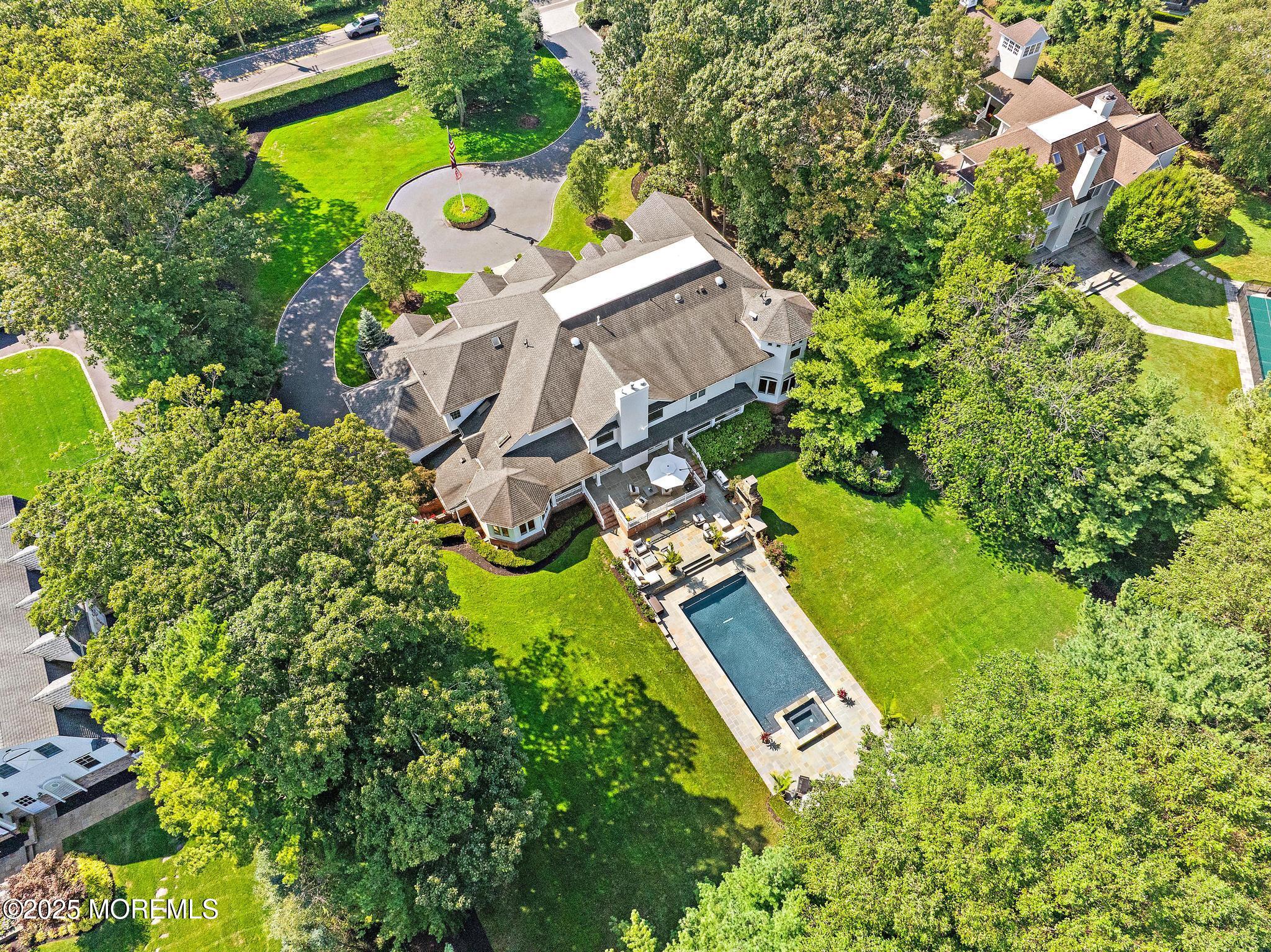 129 Ave Of Two Rivers Rumson, NJ 07760 - Photo 54 of 55 an aerial view of a house with a yard and swimming pool