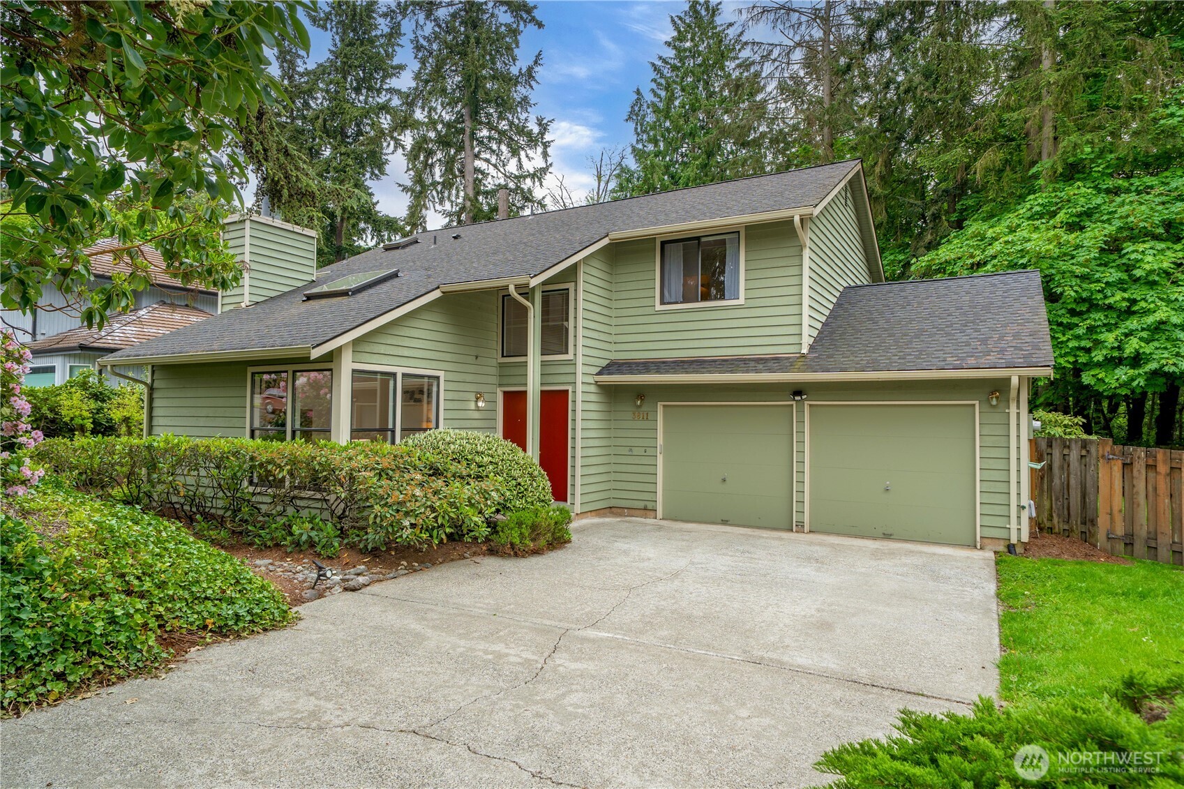 3811 South 255th Place Kent, WA 98032 - Photo 1 of 30 a front view of a house with garden