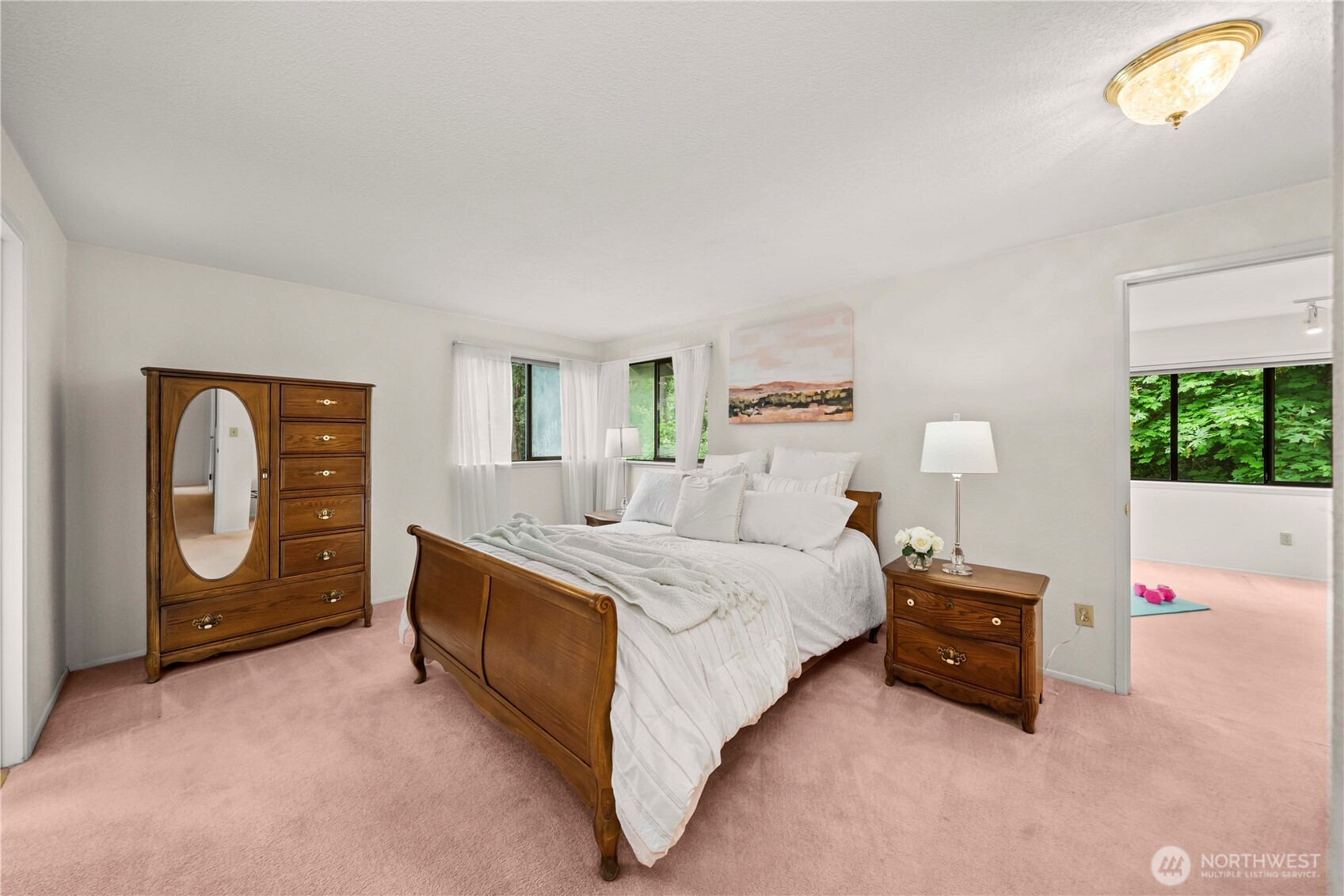 3811 South 255th Place Kent, WA 98032 - Photo 13 of 30 a spacious bedroom with a bed and a window