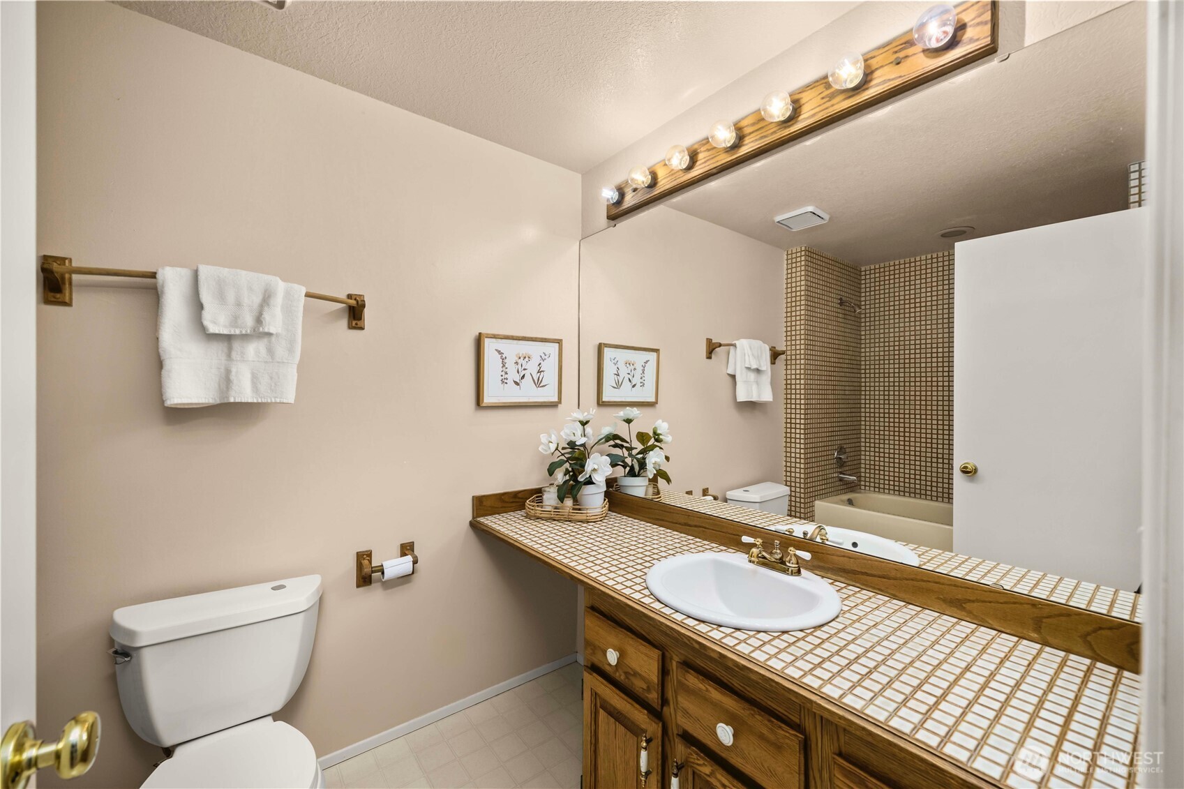 3811 South 255th Place Kent, WA 98032 - Photo 19 of 30 a bathroom with a sink and a mirror