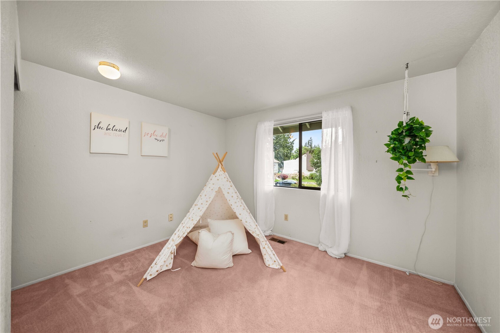 3811 South 255th Place Kent, WA 98032 - Photo 21 of 30 a view of an empty room with potted plants