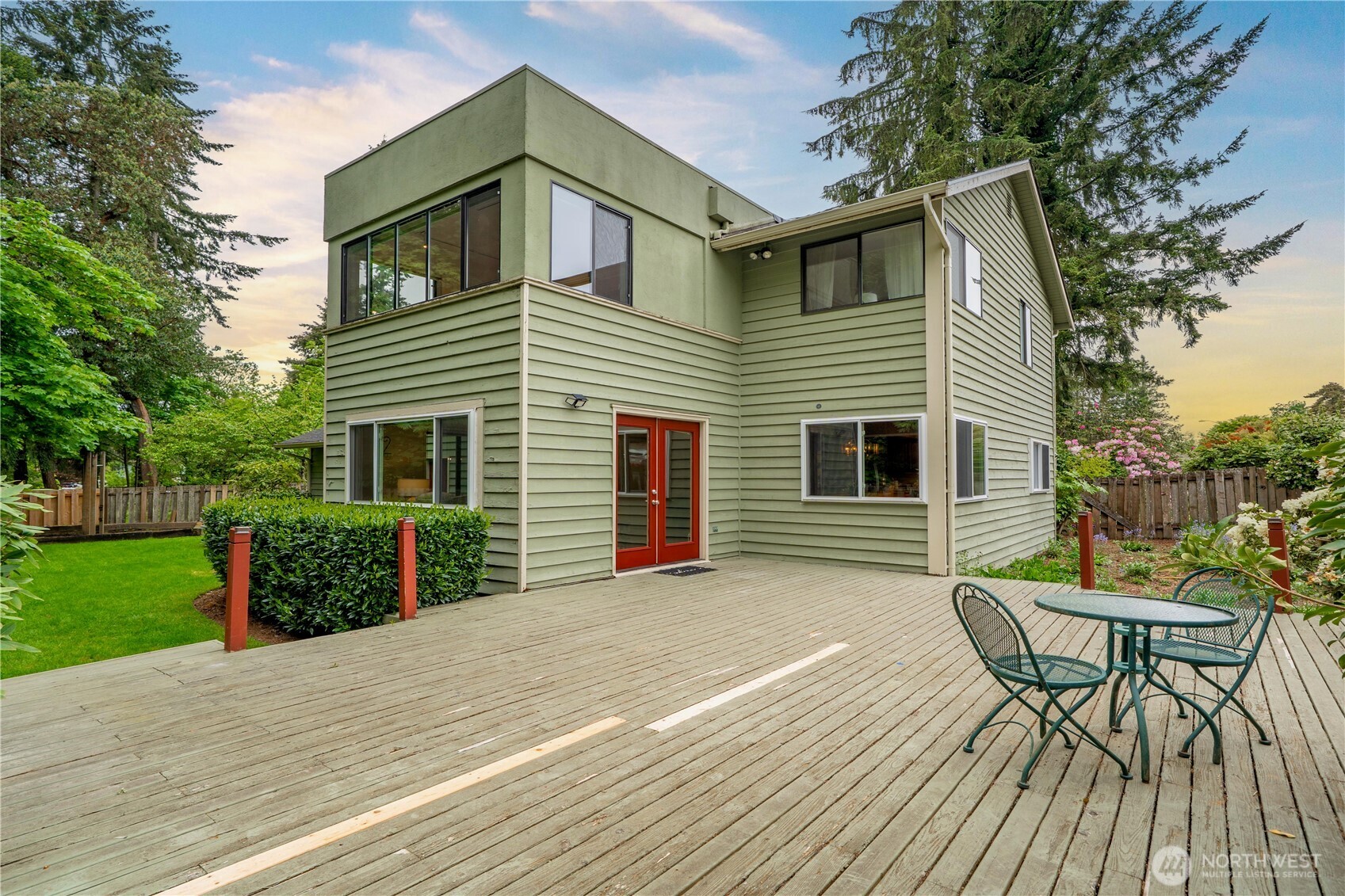 3811 South 255th Place Kent, WA 98032 - Photo 27 of 30 a front view of a house with a yard and a deck