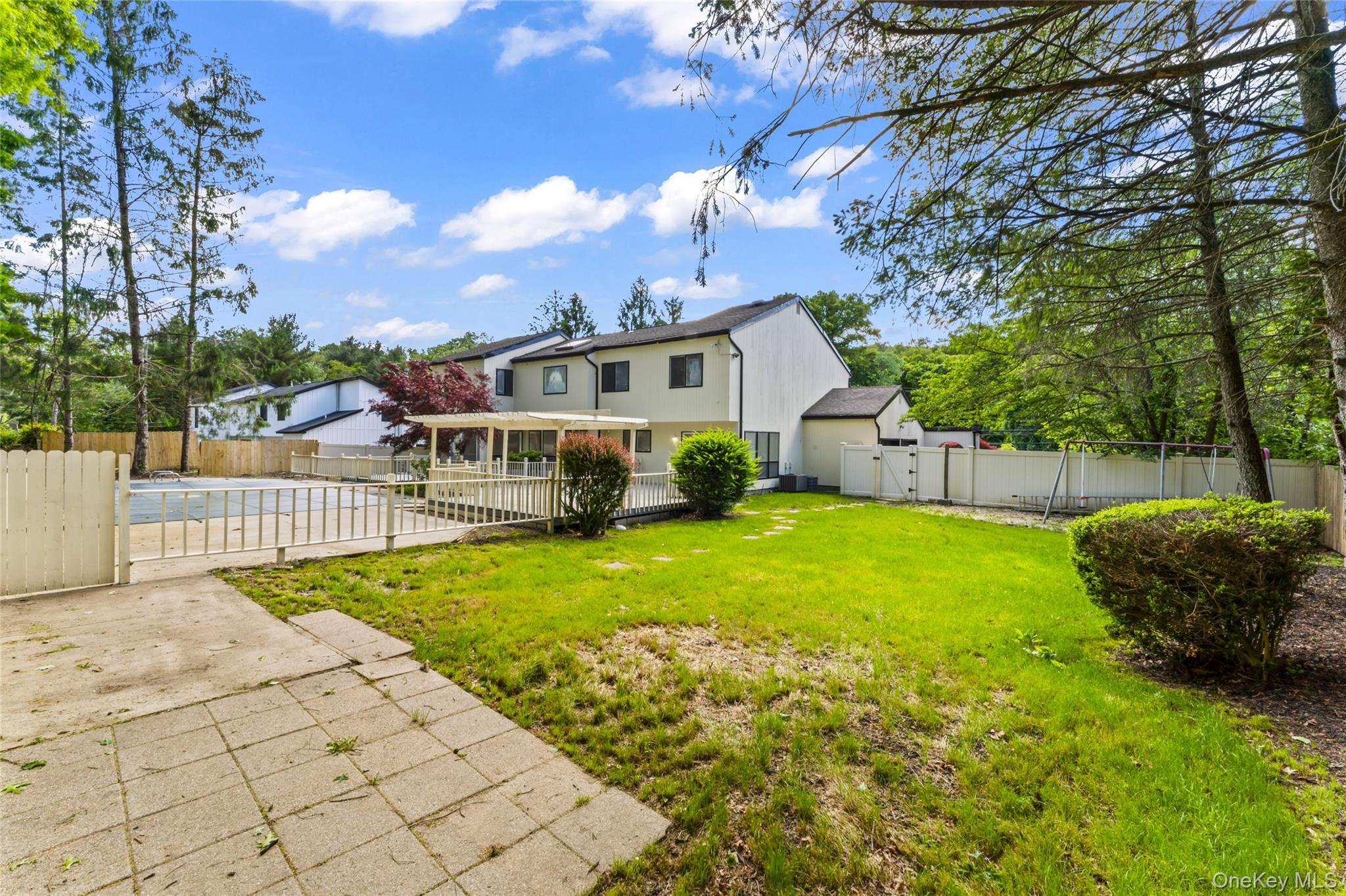 126 Bagatelle Road Melville, NY 11747 - Photo 45 of 50 a view of a house with backyard and a tree