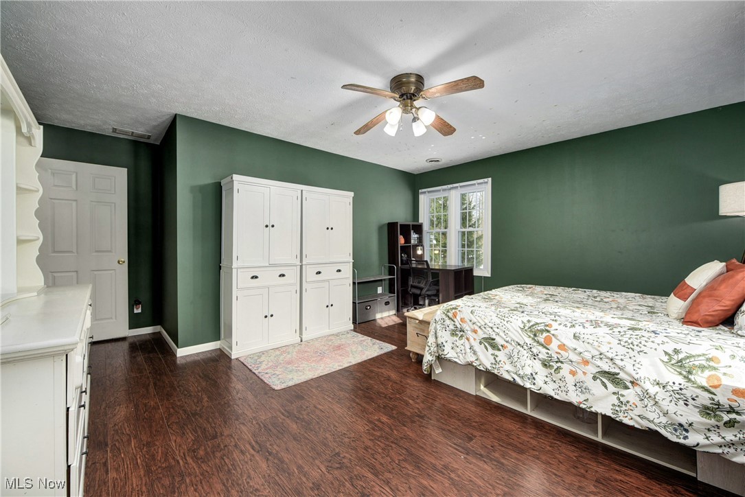 5927 Highland Road Highland Heights, OH 44143 - Photo 19 of 22 Bedroom featuring ceiling fan, dark wood-type flooring, and a textured ceiling