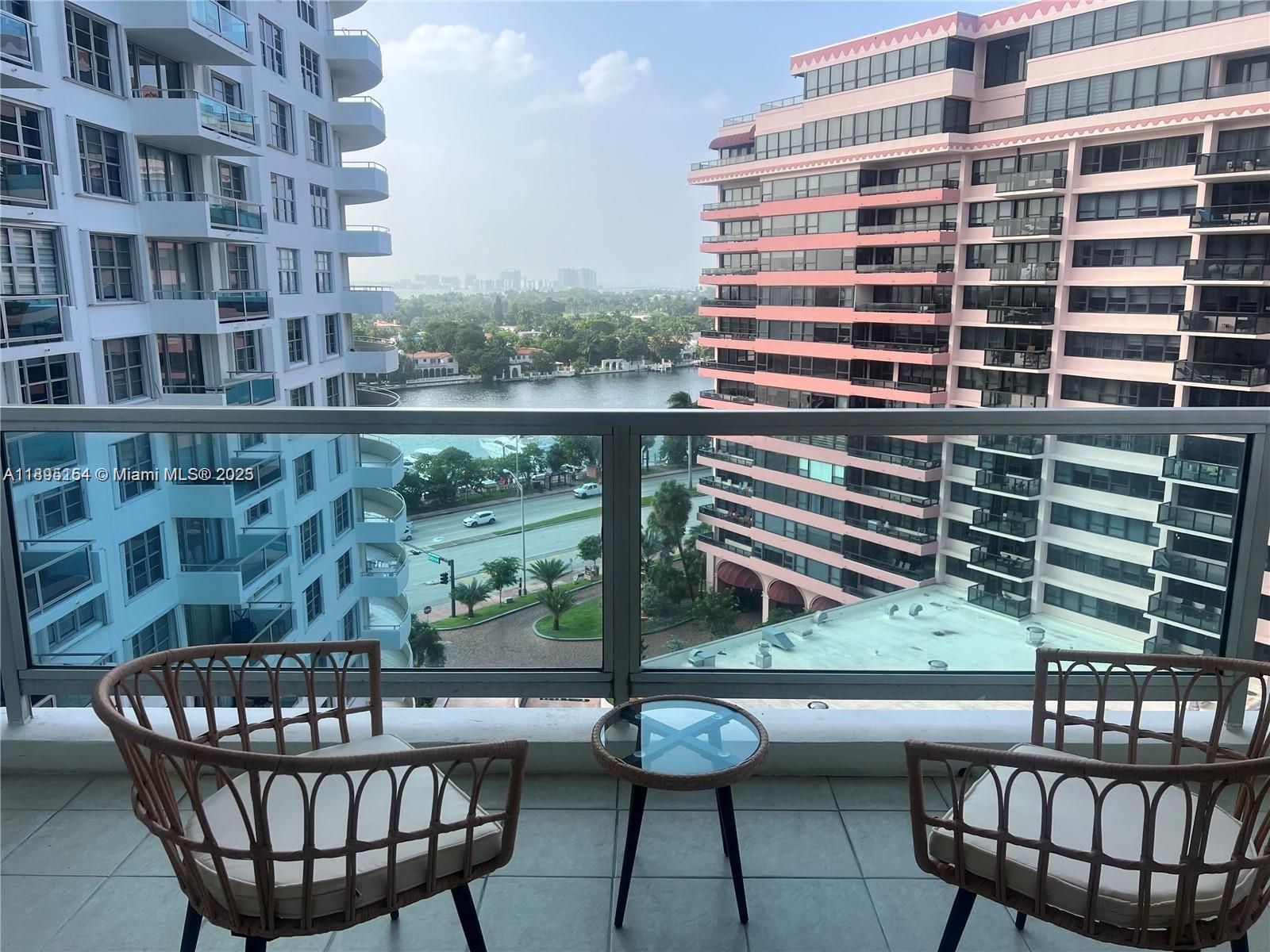 5161 Collins Avenue, Unit 1211 Miami Beach, FL 33140 - Photo 14 of 29 a view of a chairs and table in the balcony