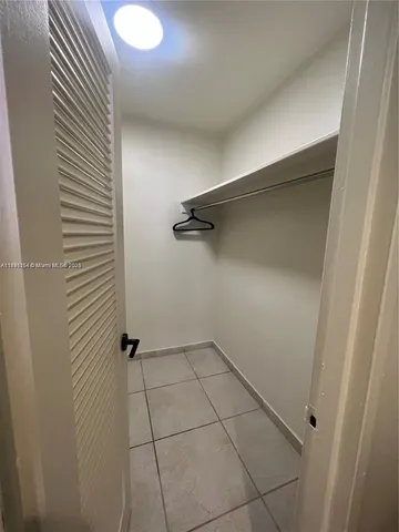 an entryway and hall with living room