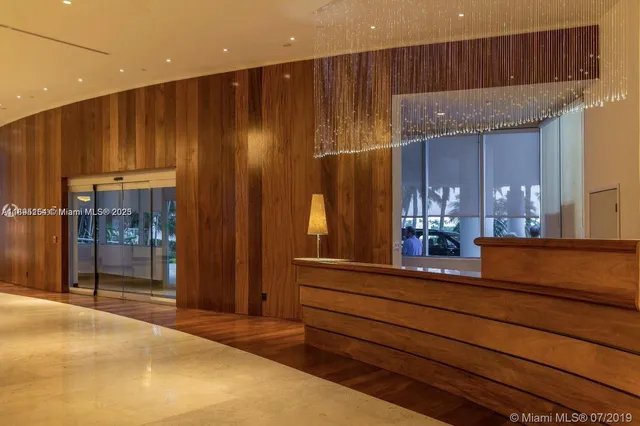 a lobby with furniture and wooden floor