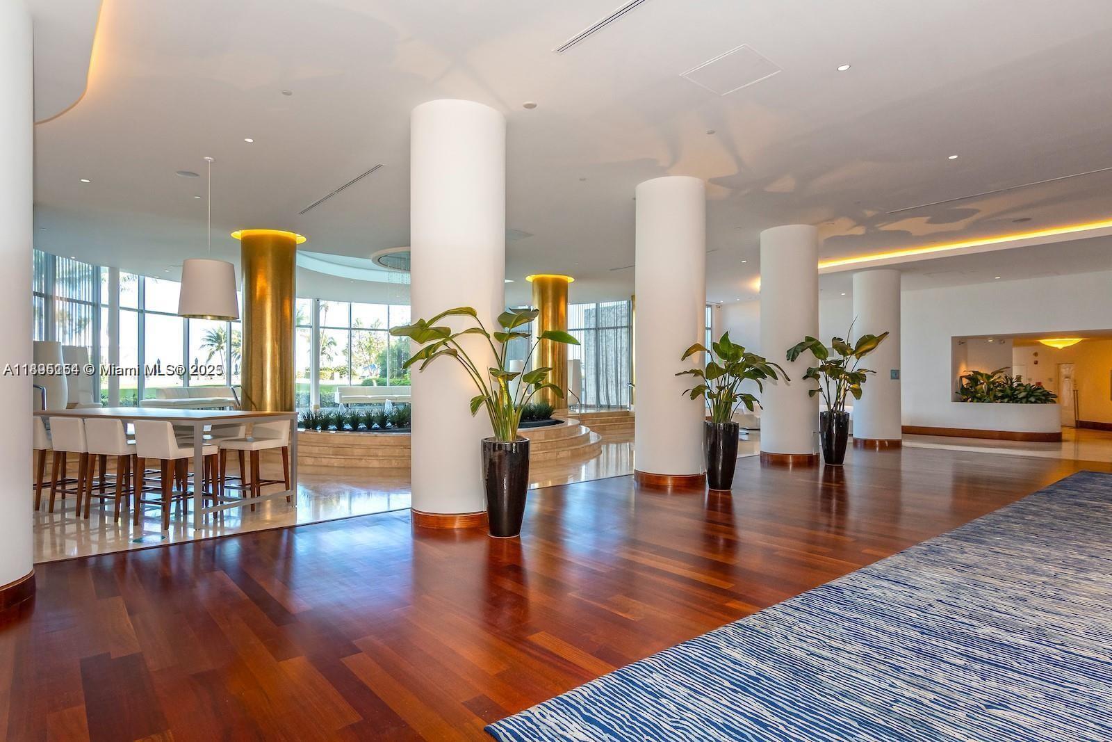 5161 Collins Avenue, Unit 1211 Miami Beach, FL 33140 - Photo 26 of 29 a lobby with furniture and wooden floor