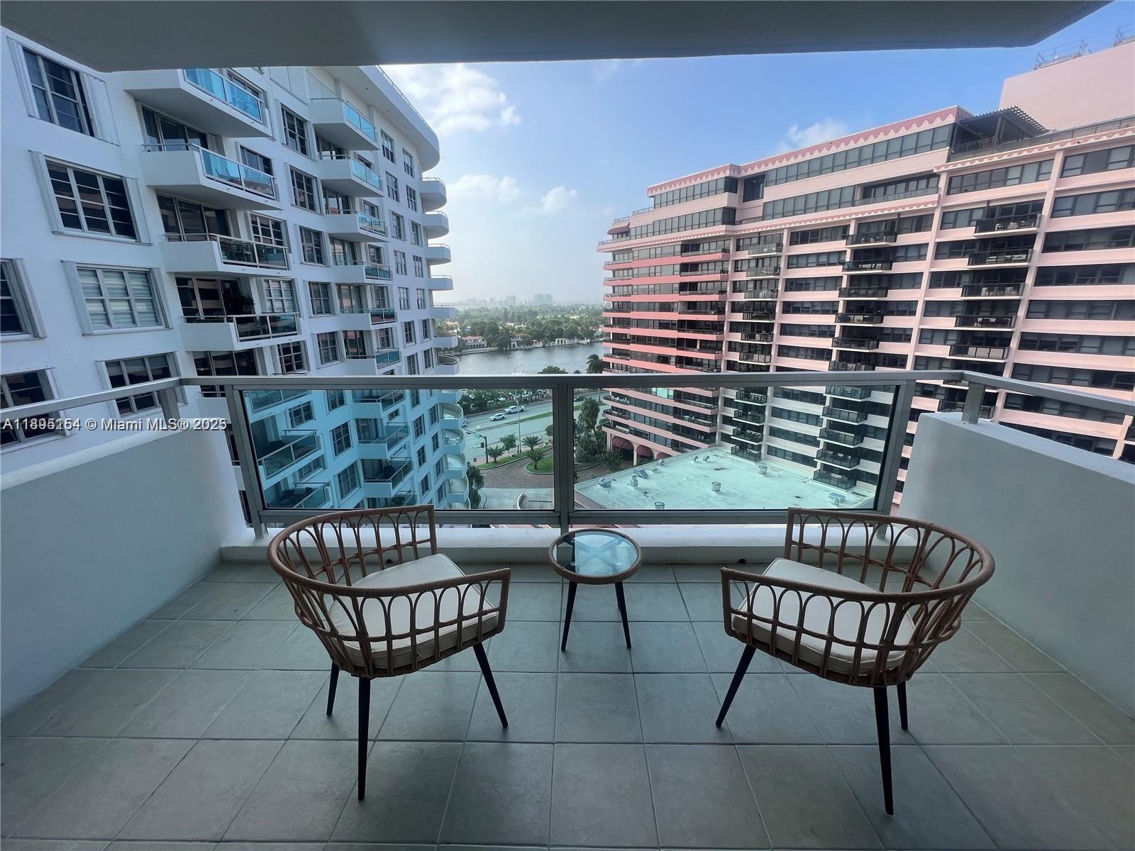 5161 Collins Avenue, Unit 1211 Miami Beach, FL 33140 - Photo 9 of 29 a chairs and a table in a balcony