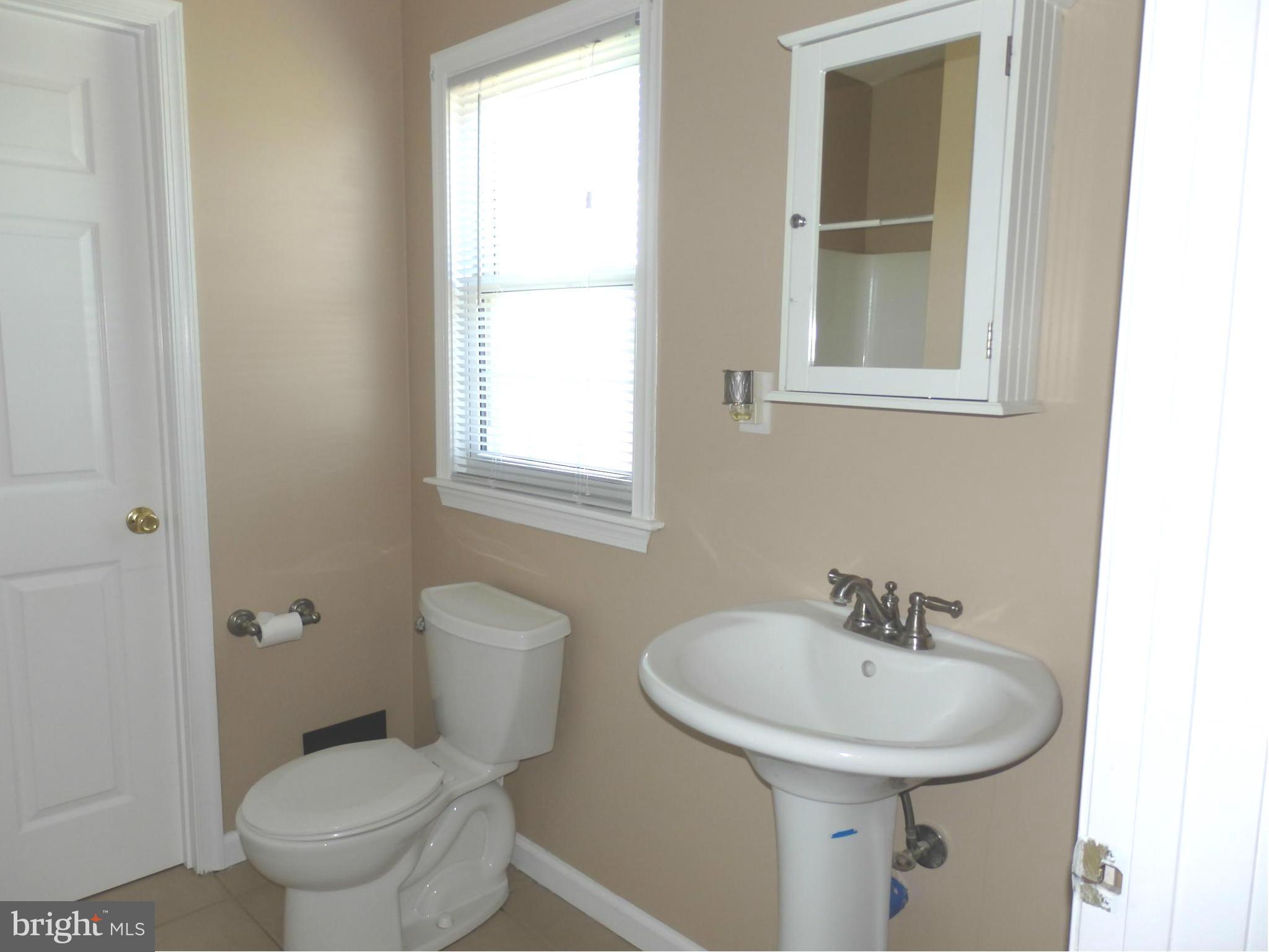 10529 White Hall Road Hagerstown, MD 21740 - Photo 11 of 29 Main level full bath has pedestal sink,