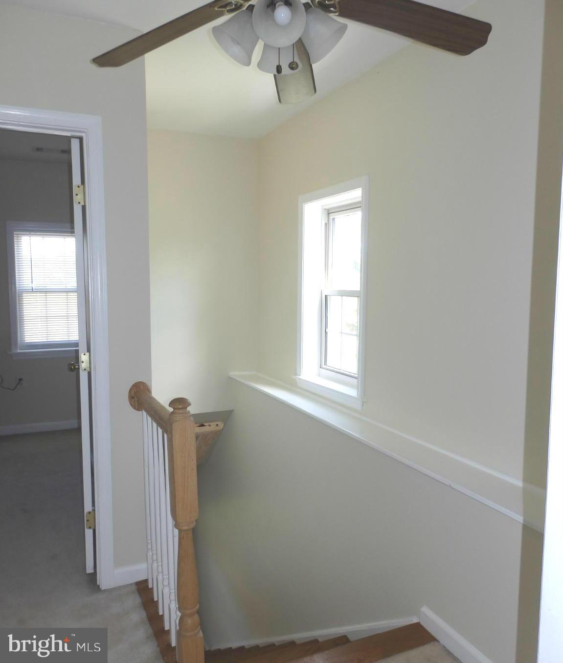 10529 White Hall Road Hagerstown, MD 21740 - Photo 18 of 29 Wood staircase has display shelf and window