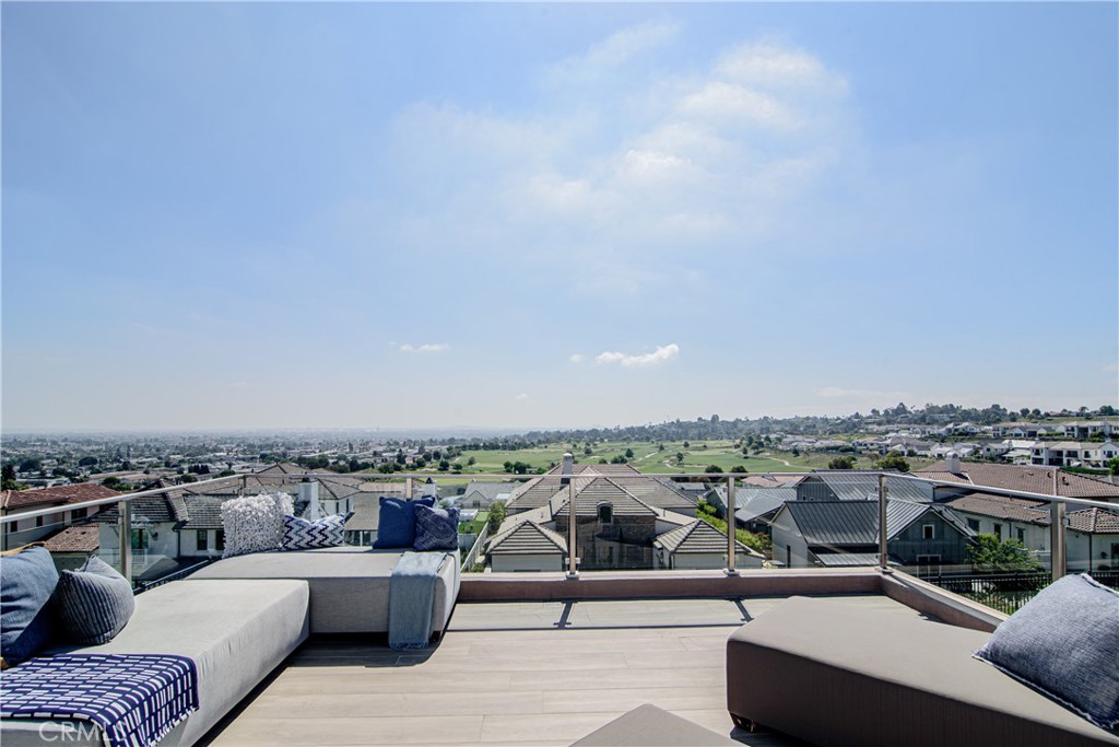 73 Chandler Ranch Road Rolling Hills Estates, CA 90274 - Photo 22 of 25 an outdoor living room with patio furniture and city view