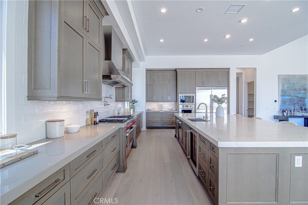 73 Chandler Ranch Road Rolling Hills Estates, CA 90274 - Photo 3 of 25 a kitchen with sink a stove and cabinets