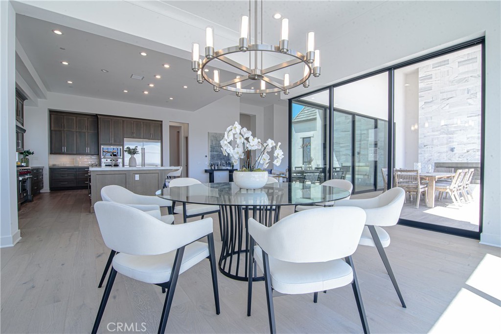73 Chandler Ranch Road Rolling Hills Estates, CA 90274 - Photo 6 of 25 a view of a dining room with furniture large windows and wooden floor