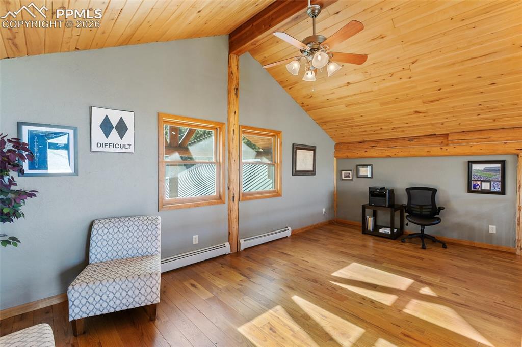 9110 Mountain Road Cascade, CO 80809 - Photo 22 of 49 a bedroom with furniture and a window