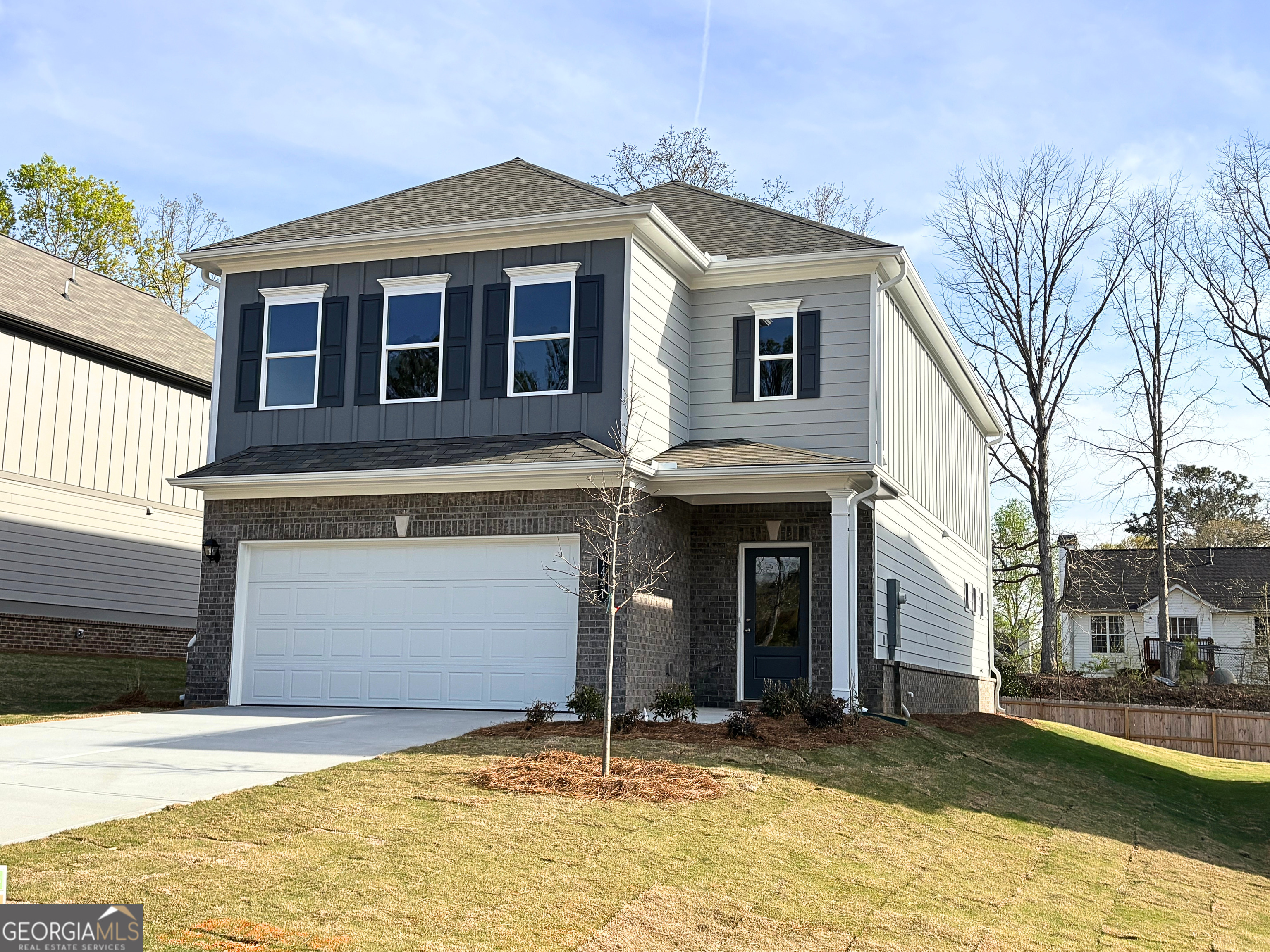 1441 Trellis Court, Unit (LOT 7) Hampton, GA 30228 - Photo 3 of 31 a front view of a house with a yard