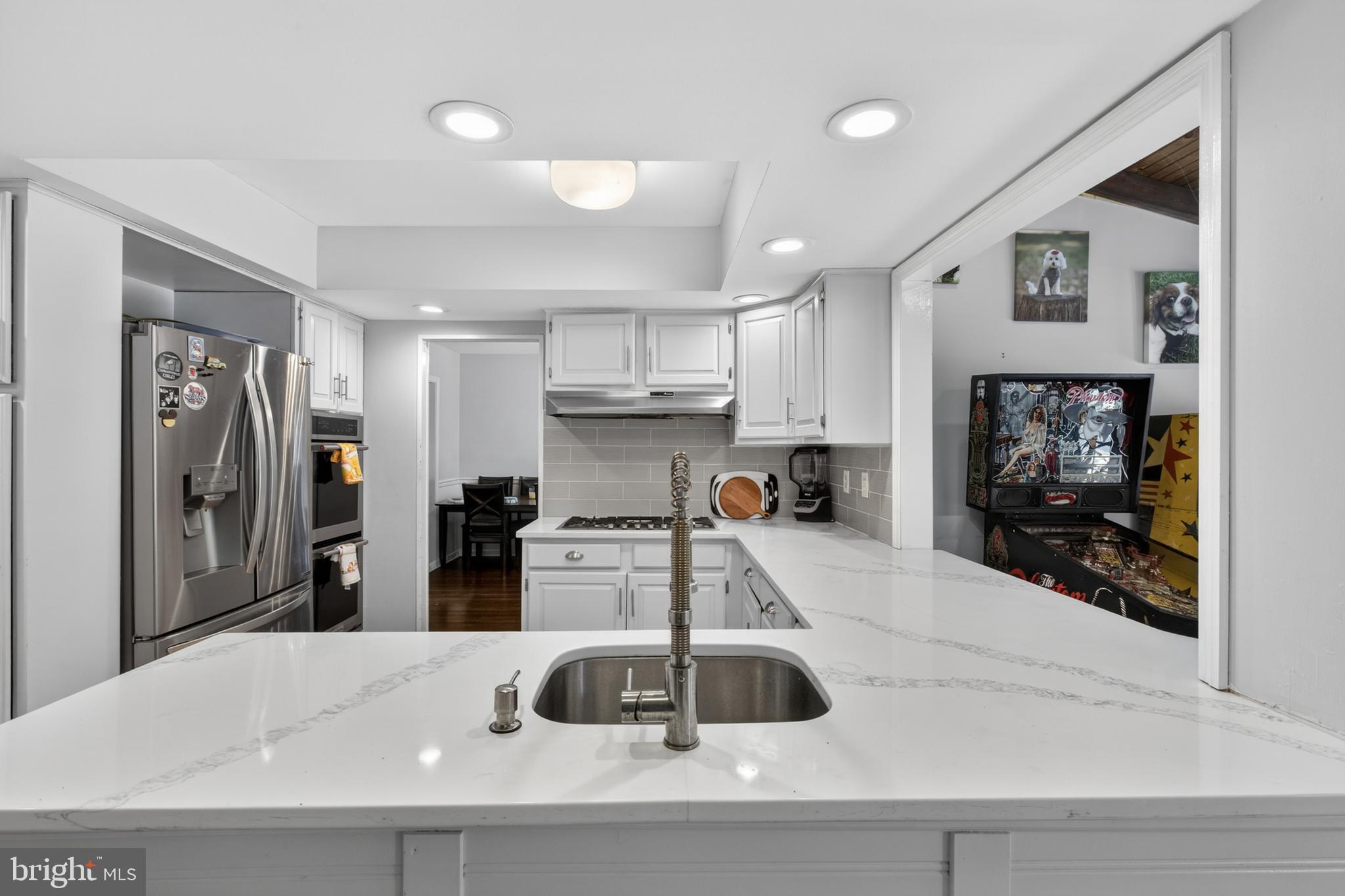 216 Revere Road Marlton, NJ 08053 - Photo 7 of 47 a kitchen with stainless steel appliances a refrigerator and a stove