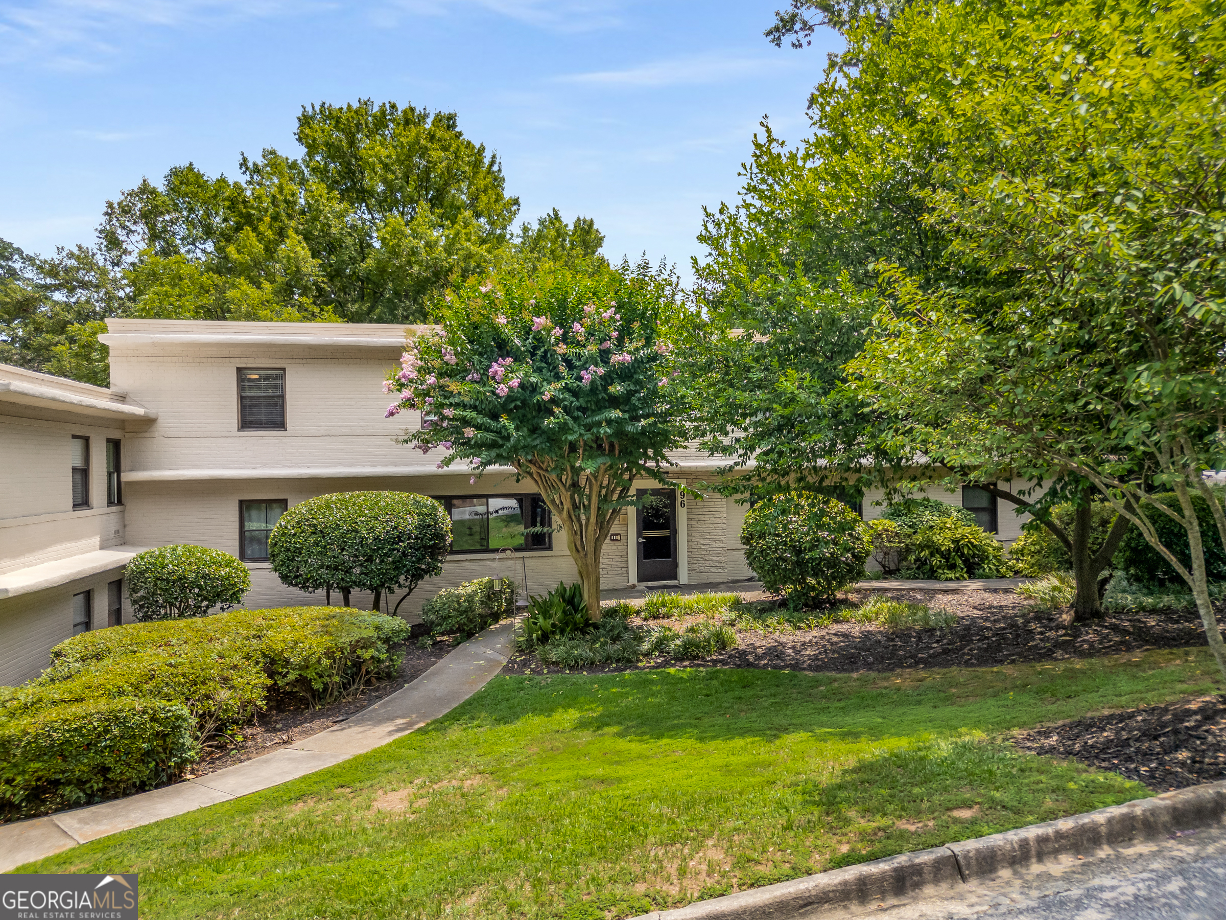 96 Ardmore Place Northwest, Unit 3 Atlanta, GA 30309 - Photo 1 of 24 a front view of house with yard and green space