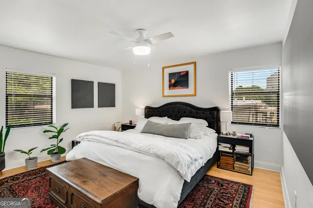 a bedroom with bed and a window