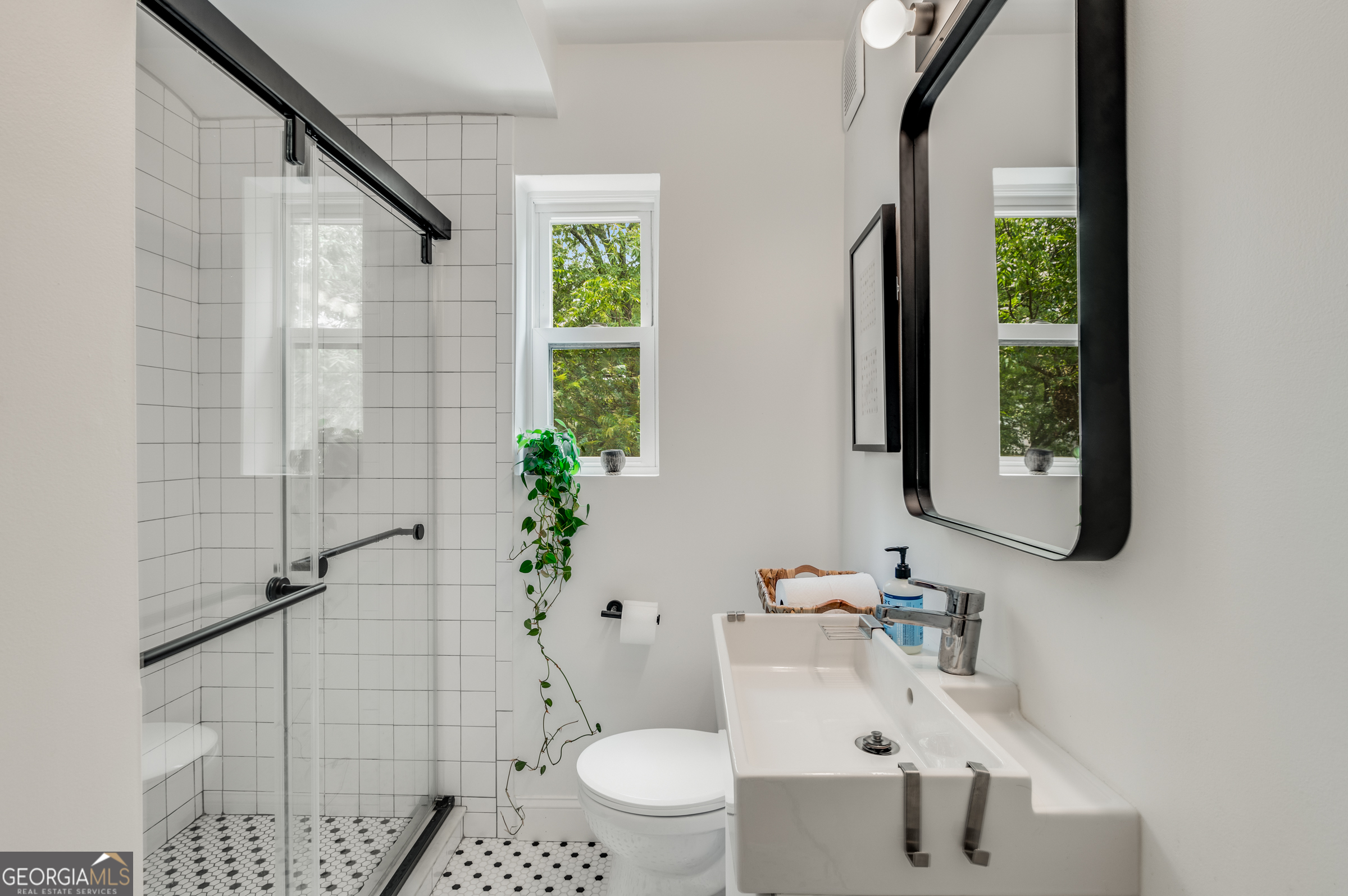 96 Ardmore Place Northwest, Unit 3 Atlanta, GA 30309 - Photo 13 of 24 a bathroom with a sink toilet and shower