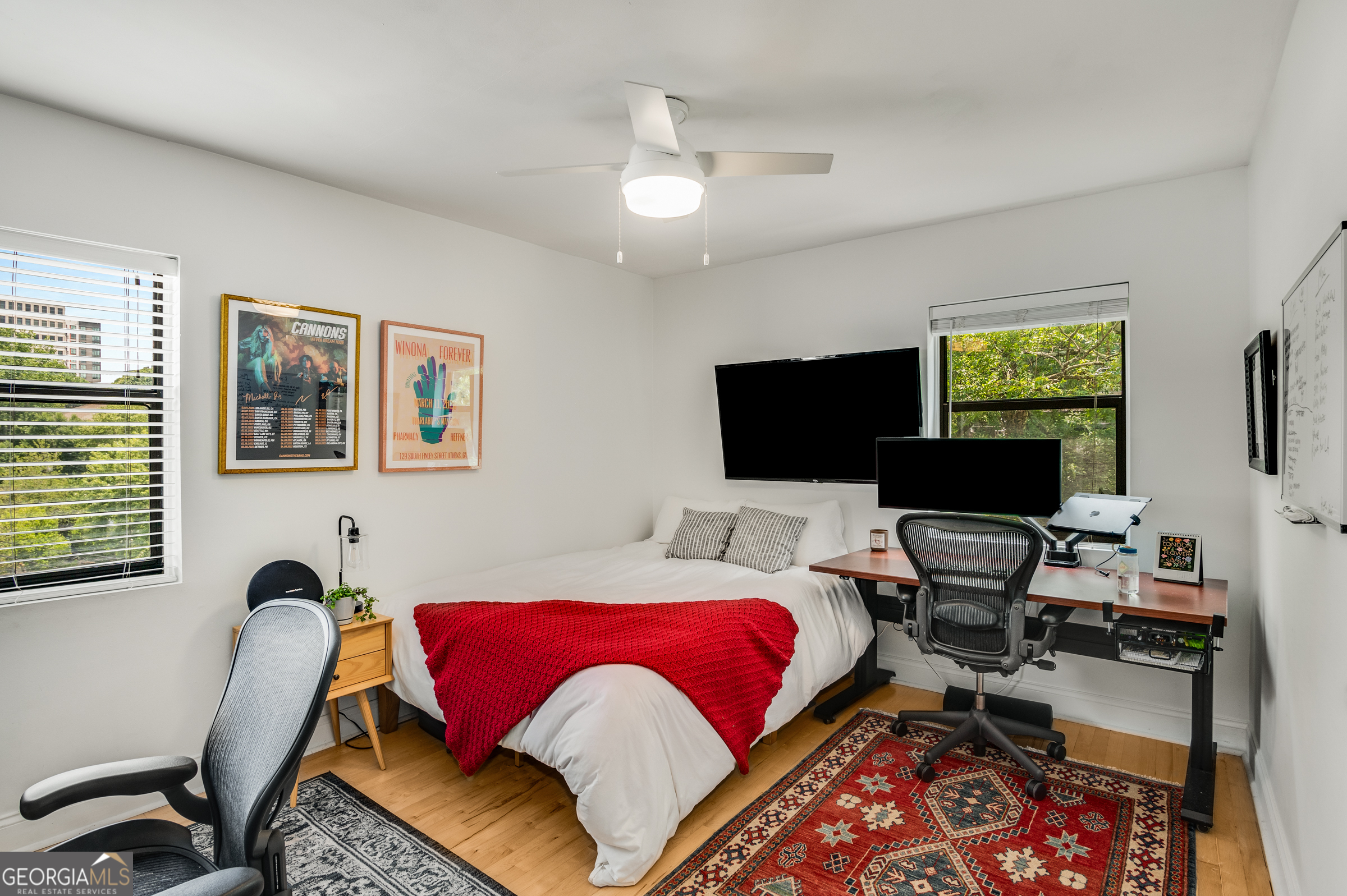 96 Ardmore Place Northwest, Unit 3 Atlanta, GA 30309 - Photo 14 of 24 a living room with furniture and a flat screen tv
