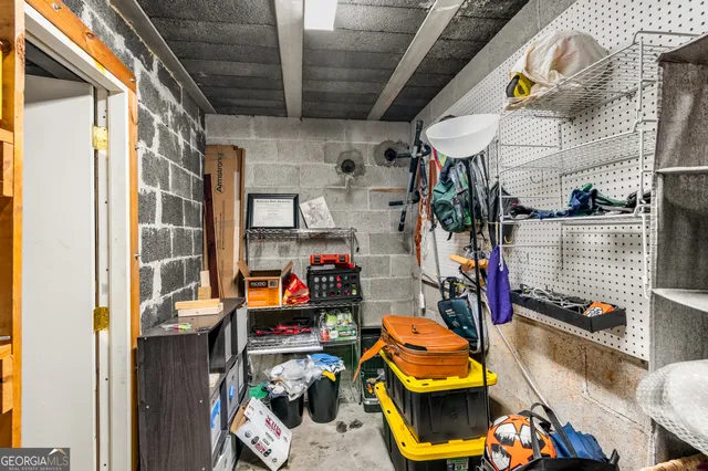 a balcony with wooden floor and outdoor seating