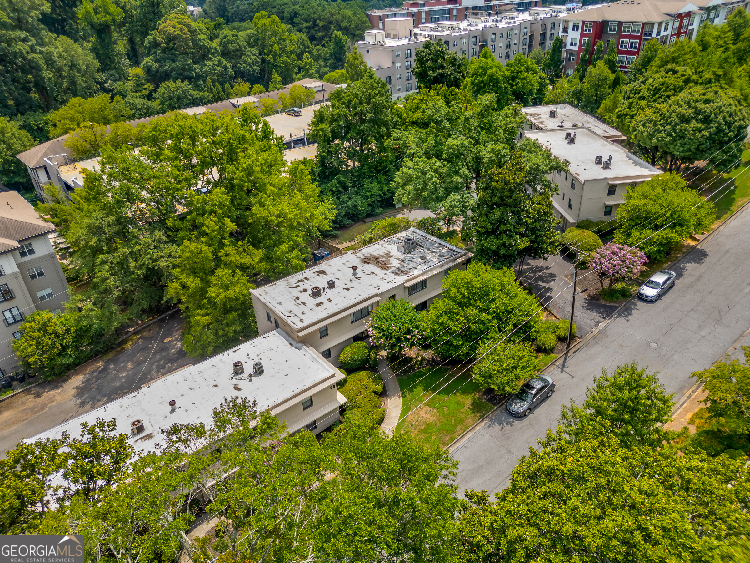 96 Ardmore Place Northwest, Unit 3 Atlanta, GA 30309 - Photo 21 of 24 an aerial view of a house with a yard and garden