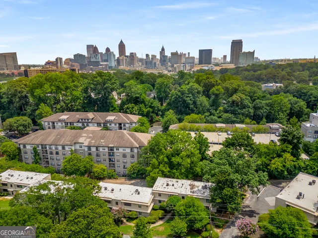 an aerial view of a house with a yard and garden