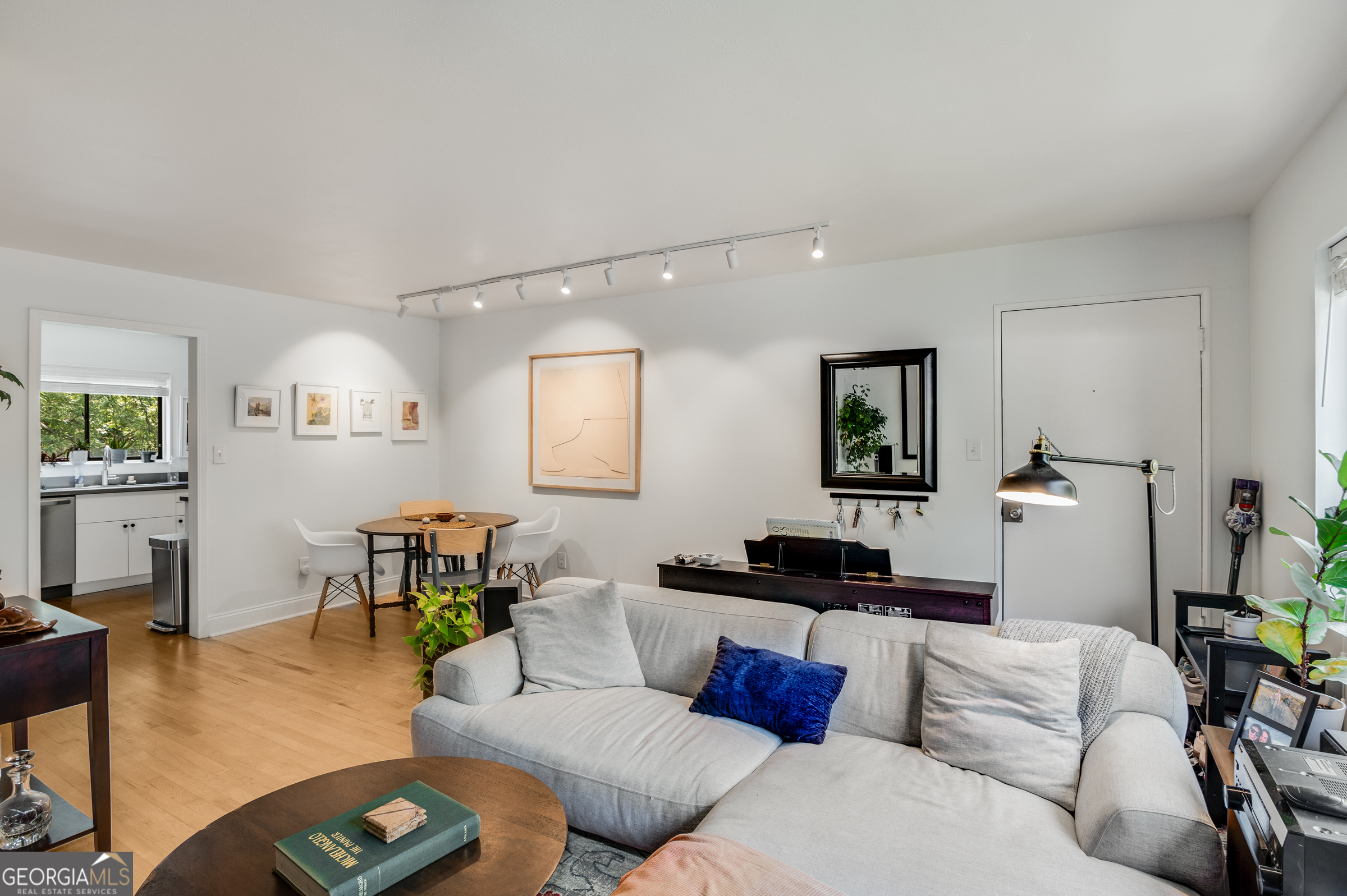 96 Ardmore Place Northwest, Unit 3 Atlanta, GA 30309 - Photo 5 of 24 a living room with furniture and wooden floor