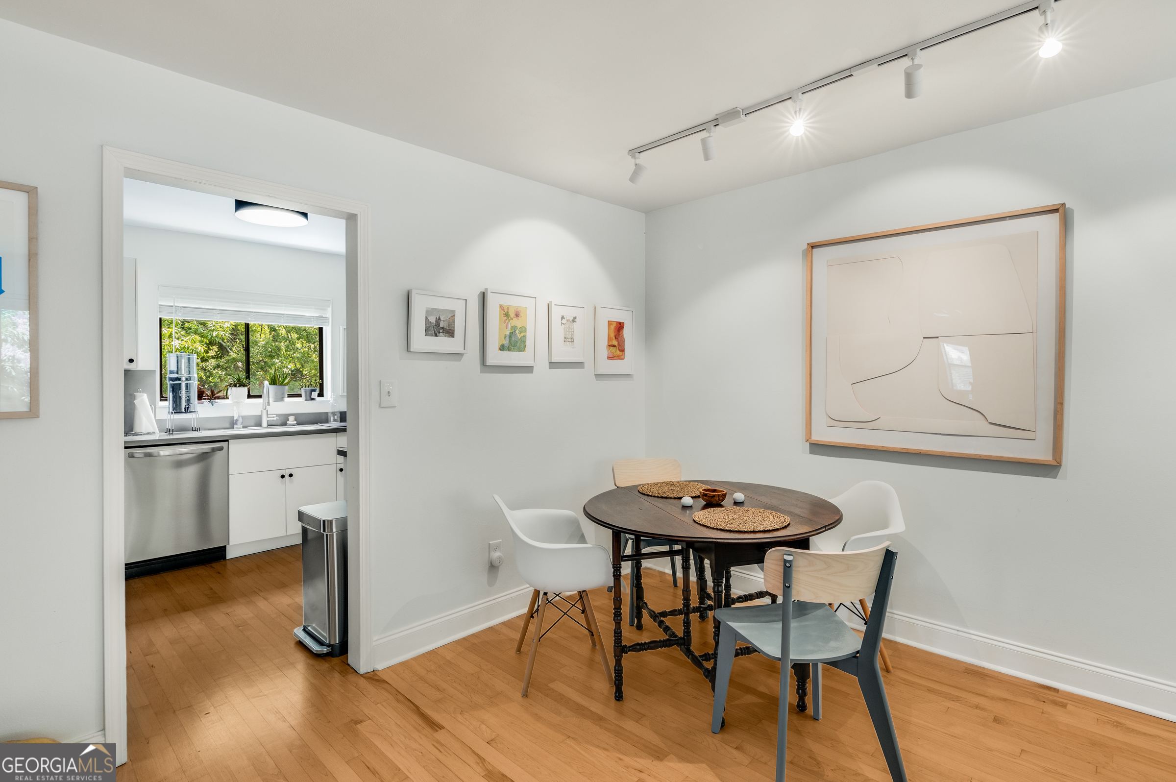 96 Ardmore Place Northwest, Unit 3 Atlanta, GA 30309 - Photo 7 of 24 a view of a dining room with furniture and wooden floor