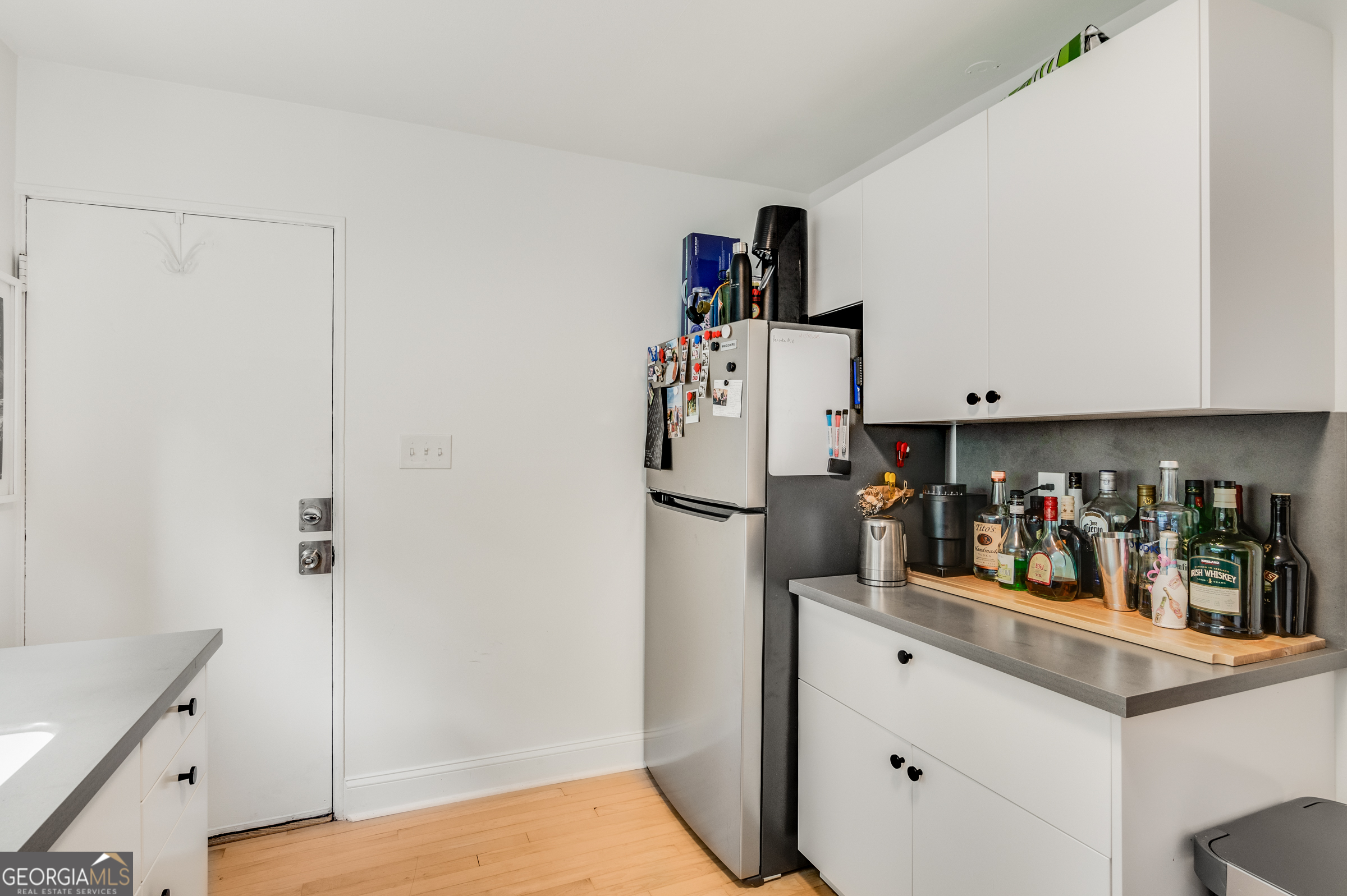 96 Ardmore Place Northwest, Unit 3 Atlanta, GA 30309 - Photo 10 of 24 a view of a kitchen with fridge and closet