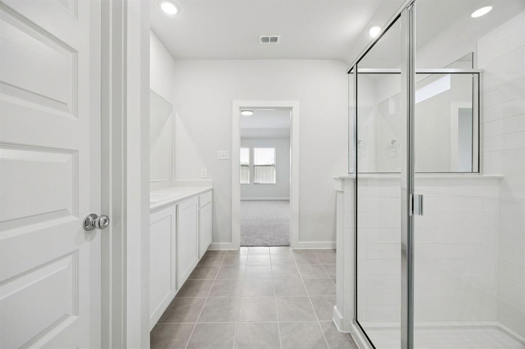 6628 Dusty Rdg Road Fort Worth, TX 76123 - Photo 17 of 27 Primary Bathroom in the Heisman home plan by Trophy Signature Homes – REPRESENTATIVE PHOTO