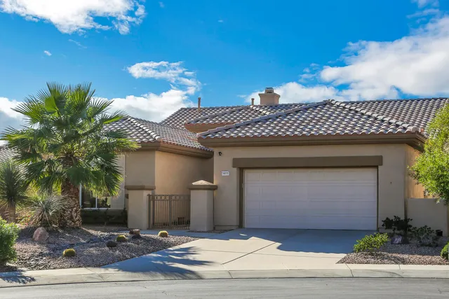 a front view of a house with a garage