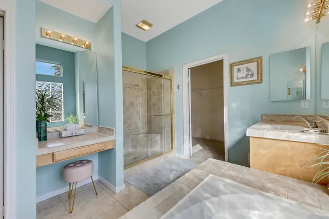 a room with a bed and a table in it