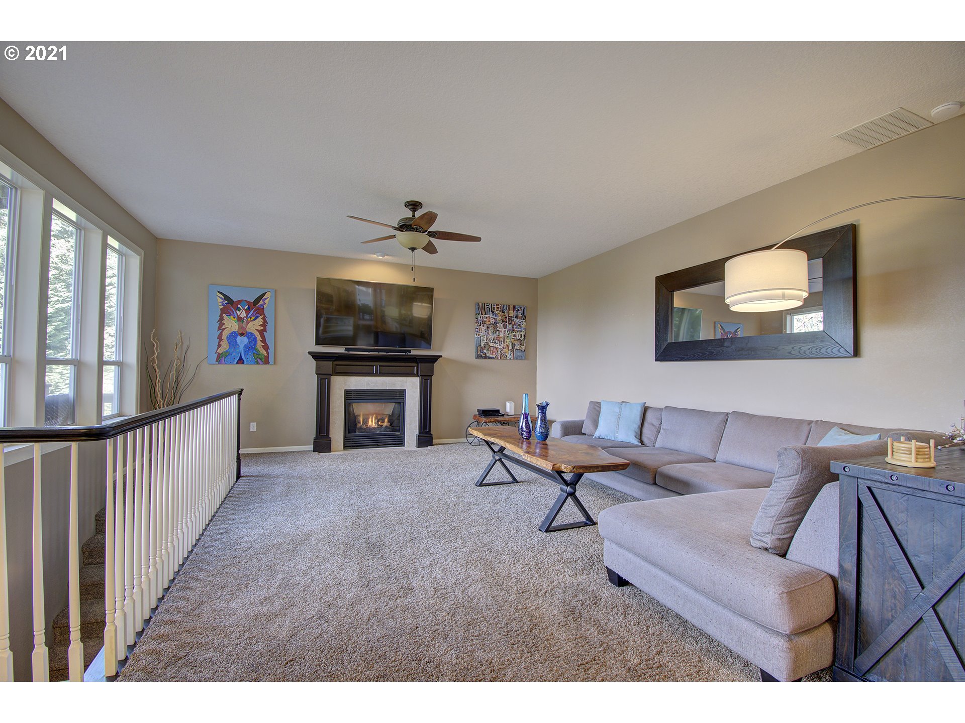 16010 Northeast 25th Avenue Ridgefield, WA 98642 - Photo 11 of 32 a living room with furniture and a flat screen tv