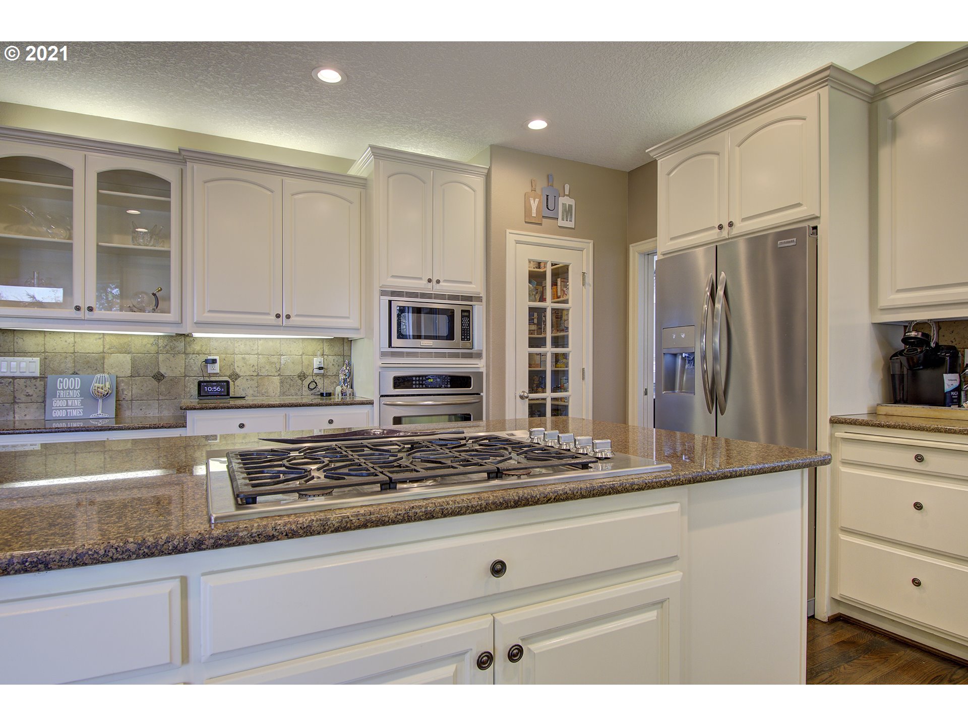16010 Northeast 25th Avenue Ridgefield, WA 98642 - Photo 14 of 32 a kitchen with stainless steel appliances granite countertop a stove and a refrigerator
