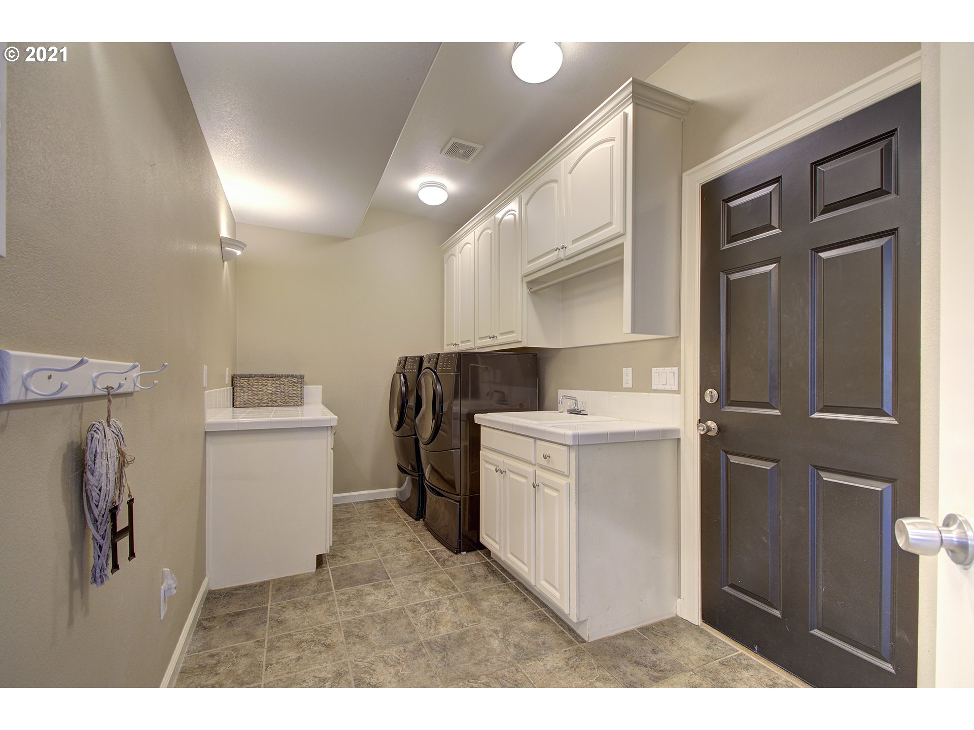 16010 Northeast 25th Avenue Ridgefield, WA 98642 - Photo 17 of 32 a utility room with cabinets washer and dryer