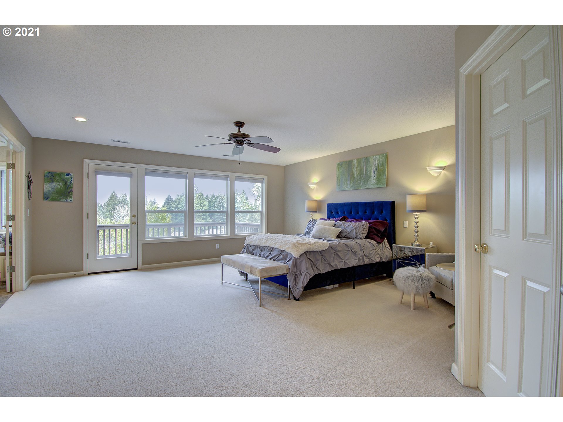 16010 Northeast 25th Avenue Ridgefield, WA 98642 - Photo 18 of 32 a spacious bedroom with a bed and a large window