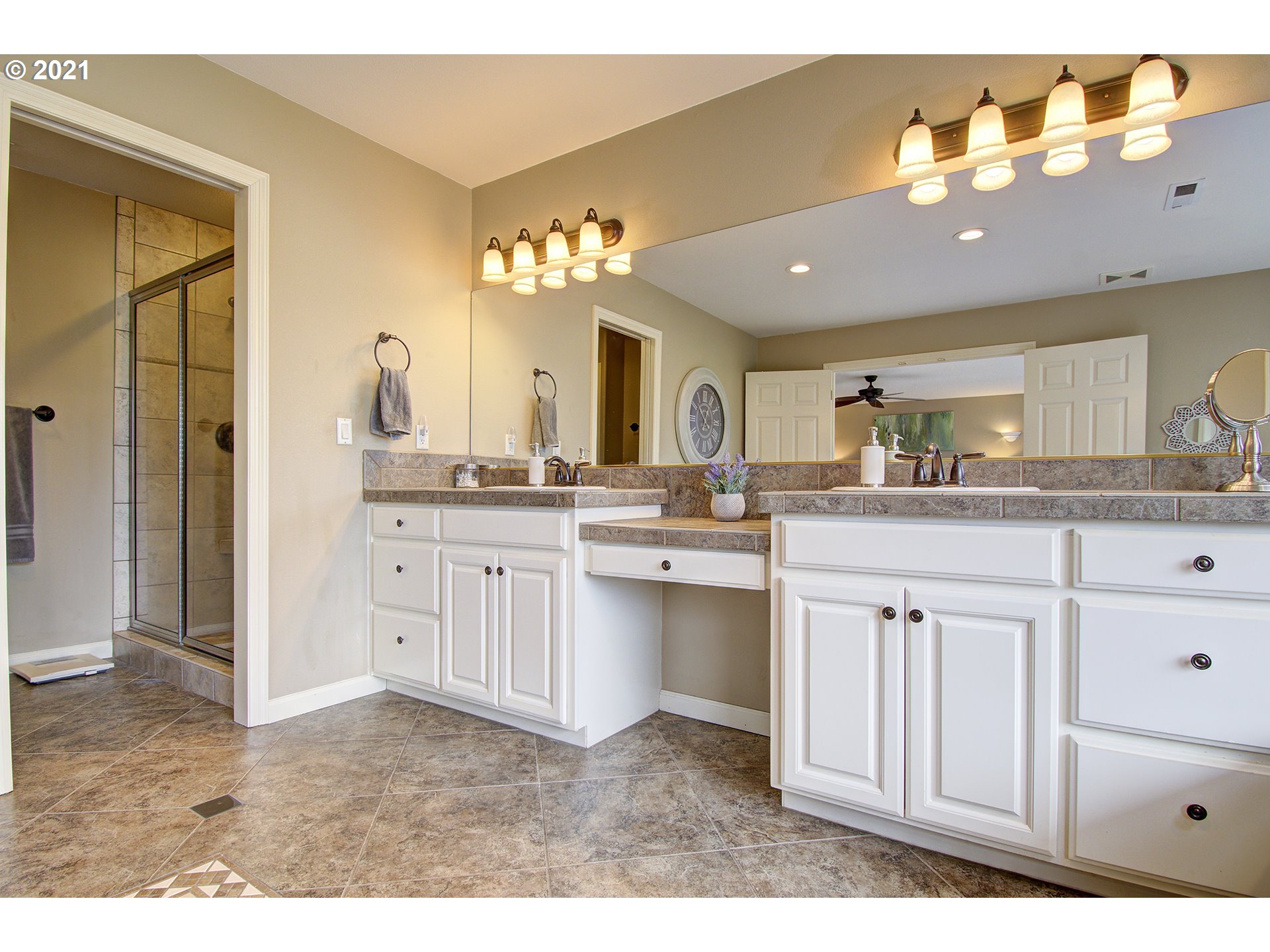 16010 Northeast 25th Avenue Ridgefield, WA 98642 - Photo 22 of 32 a bathroom with a sink vanity and mirror