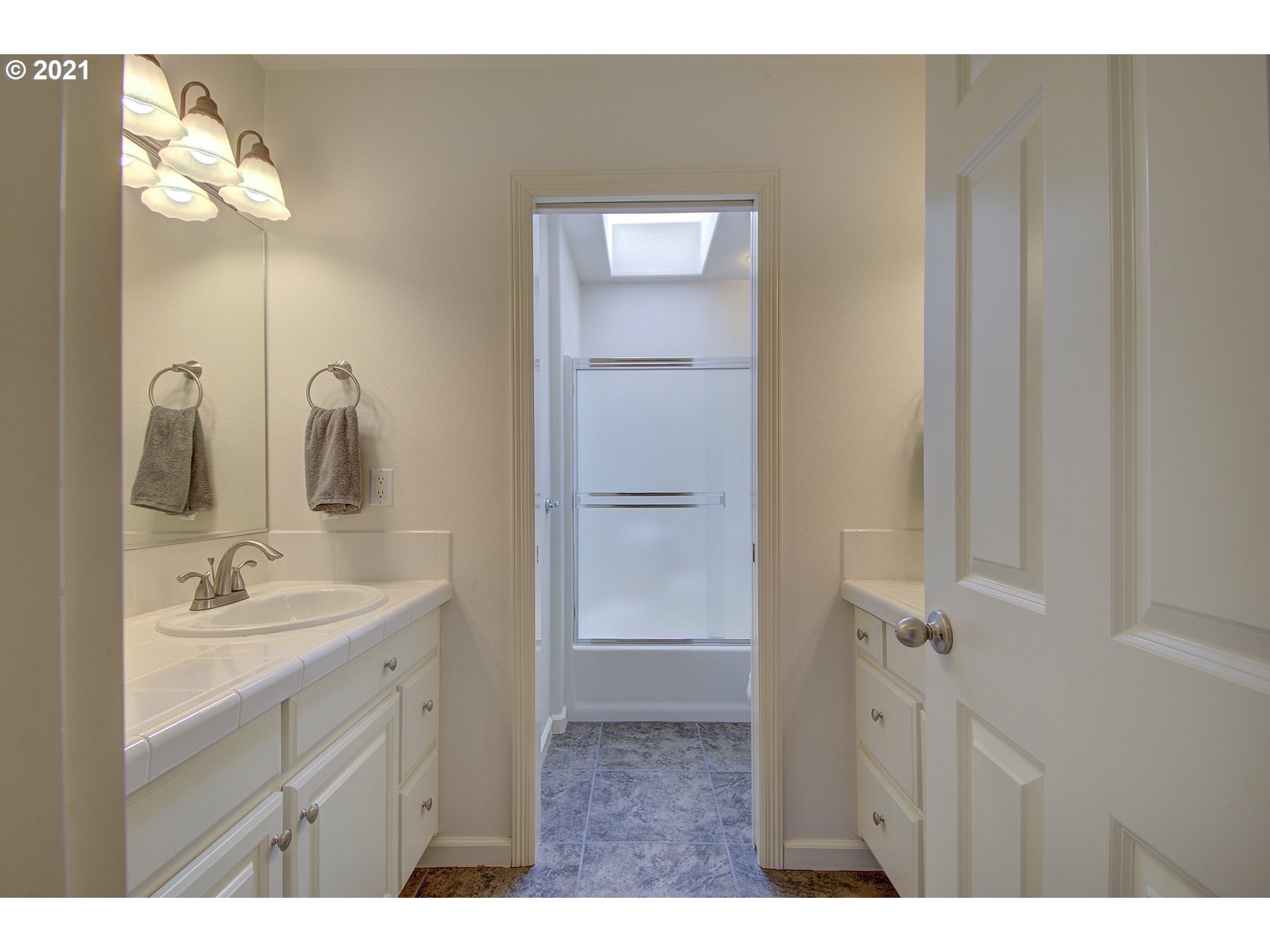 16010 Northeast 25th Avenue Ridgefield, WA 98642 - Photo 26 of 32 a bathroom with a double vanity sink and mirror