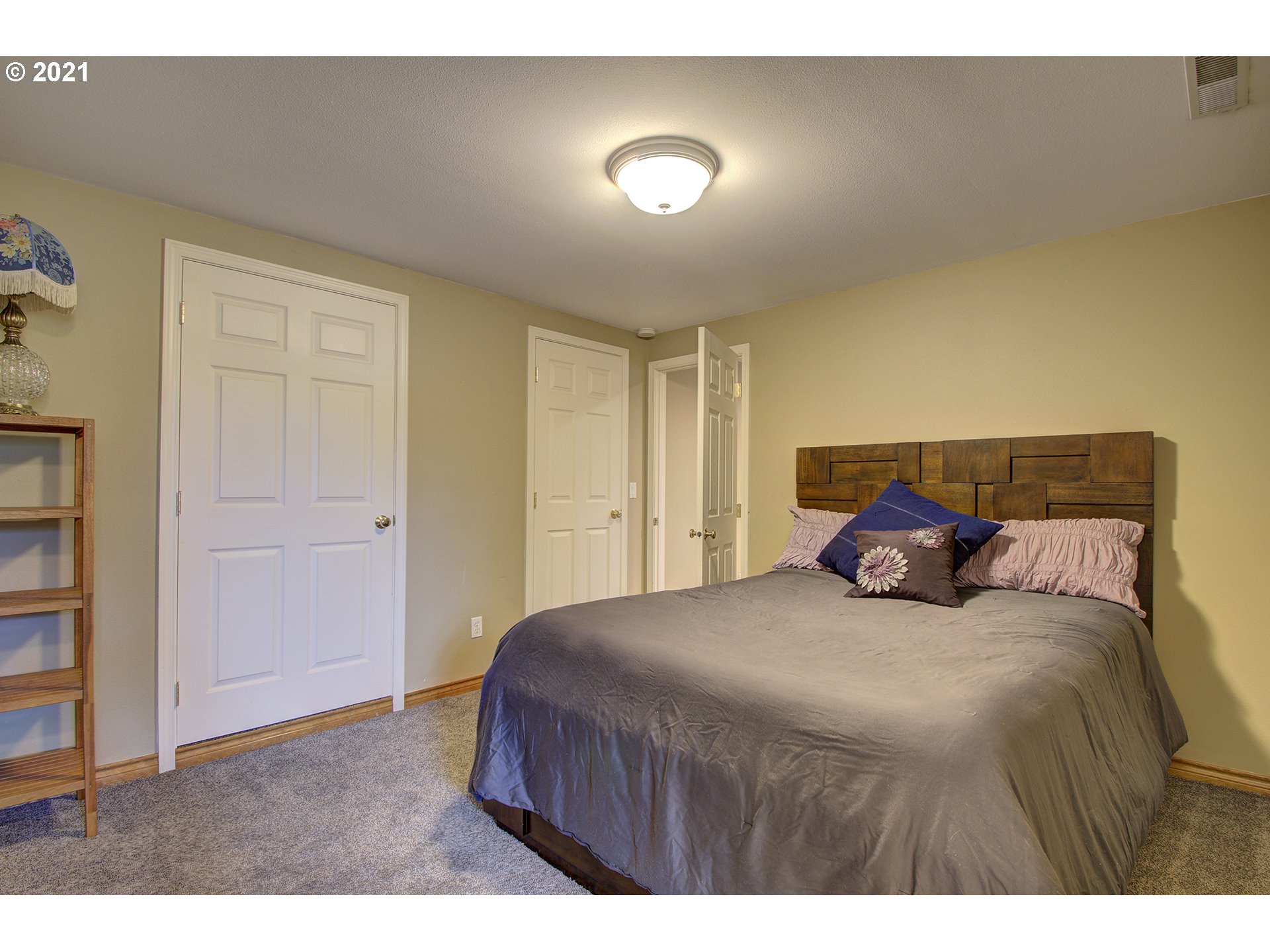 16010 Northeast 25th Avenue Ridgefield, WA 98642 - Photo 29 of 32 a bedroom with a bed and a night stand