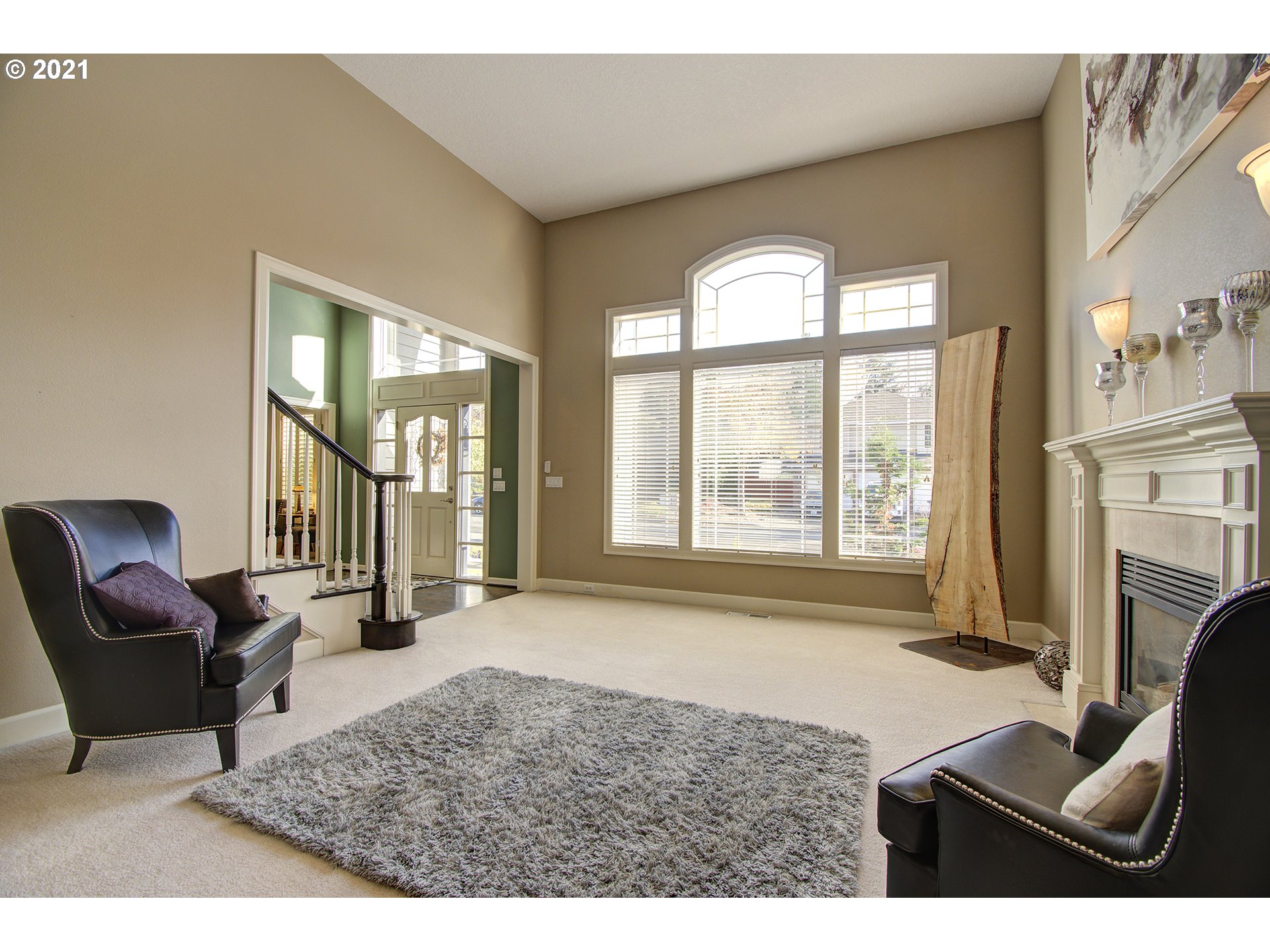 16010 Northeast 25th Avenue Ridgefield, WA 98642 - Photo 6 of 32 a living room with furniture and a fireplace