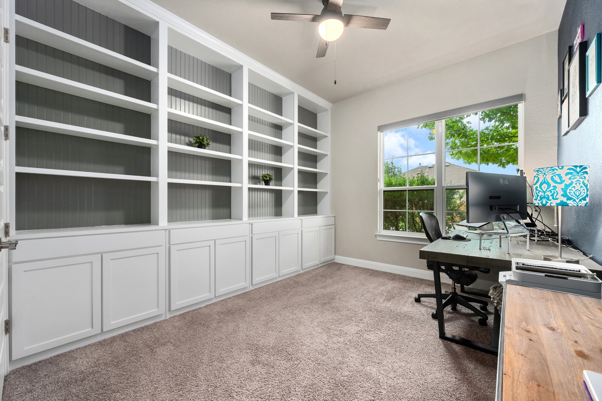 3925 Tavarez Street Round Rock, TX 78628 - Photo 18 of 27 Second bedroom with custom shelves and cabinets makes a perfect office or study